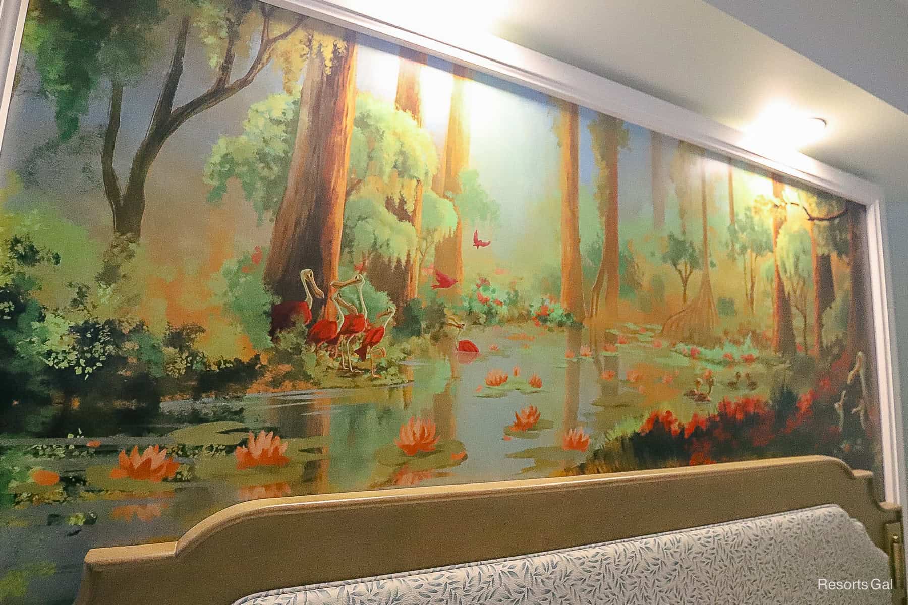 bayou artwork above the room's second headboard that shows a forest scene