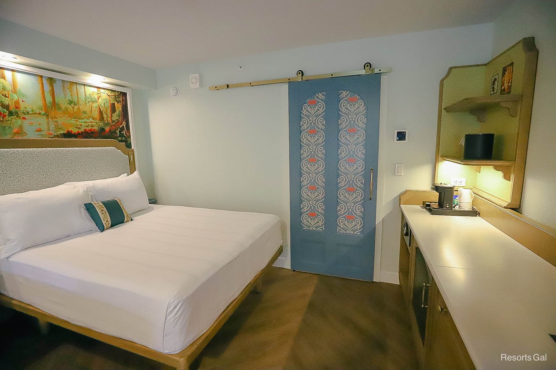 the sliding door acts as a partition between the bath and room area