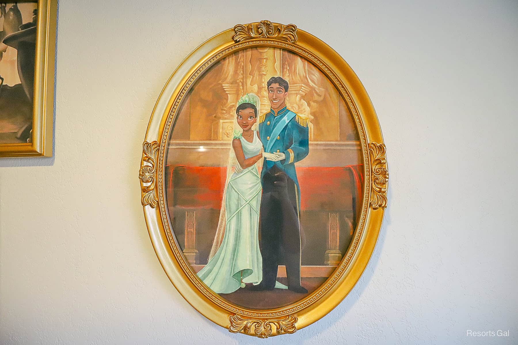 an oval shaped painting of Princess Tiana with Prince Naveen