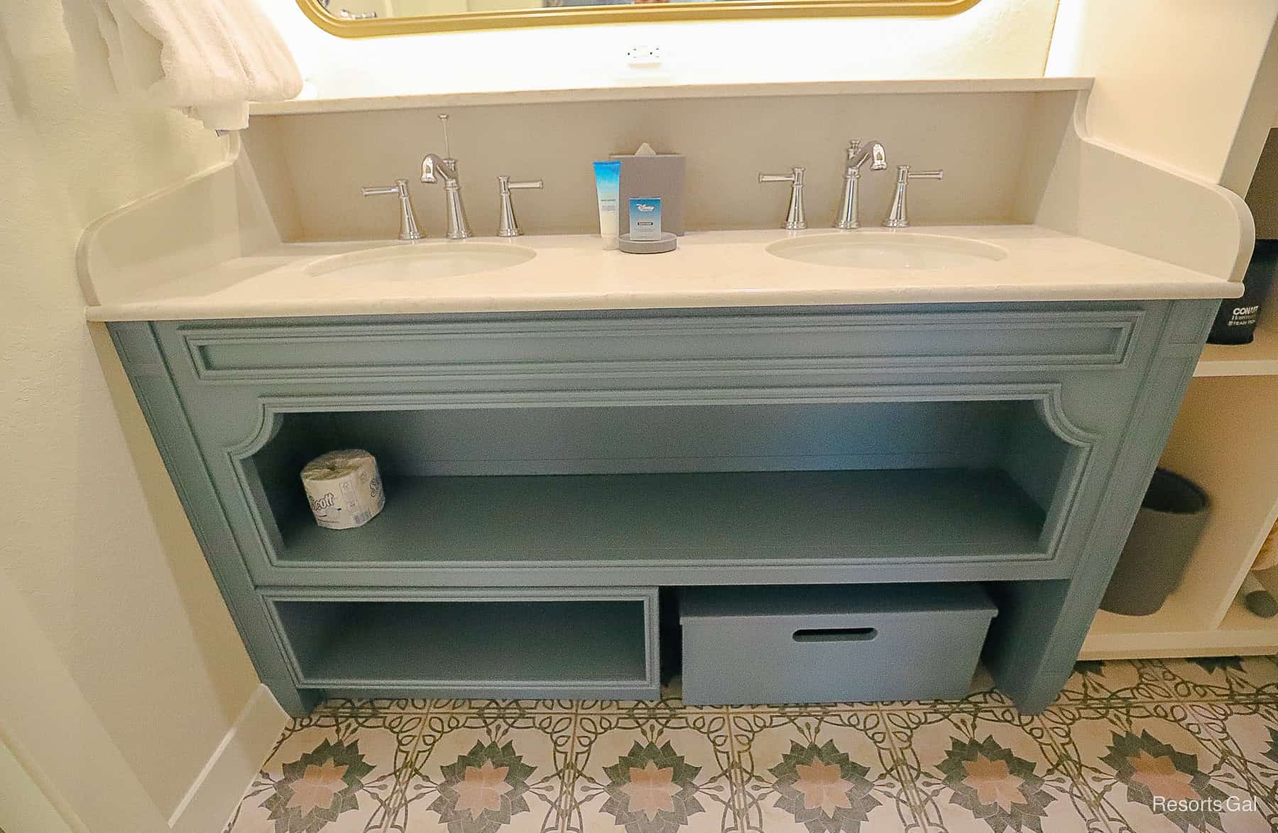 the vanity with storage space in the bath of the rooms at Port Orleans Riverside