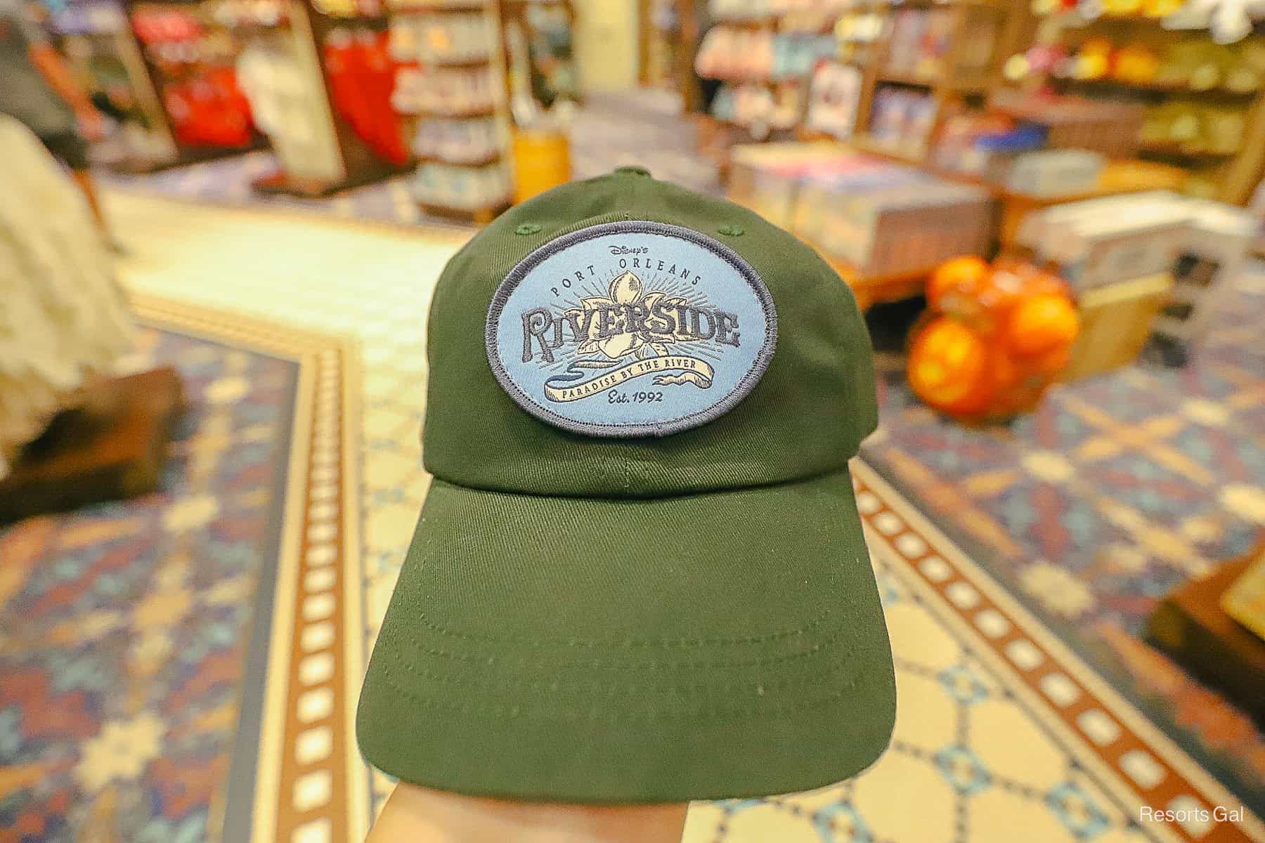 the front of a Port Orleans Riverside green hat