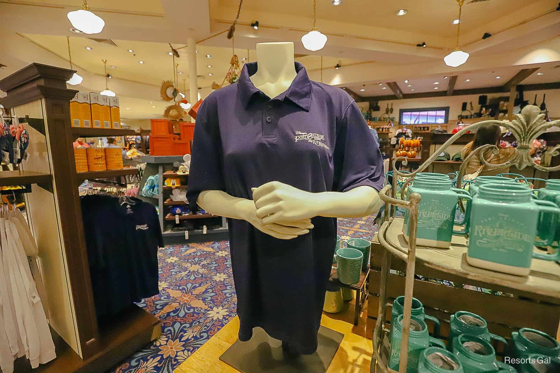 a navy blue polo shirt with Disney's Port Orleans Riverside Logo