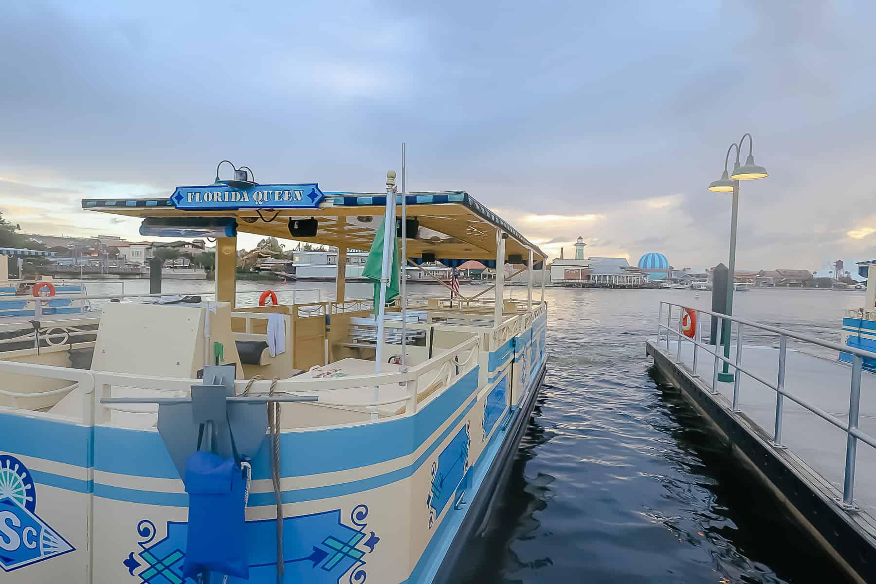 a water taxi sitting at the dock of Disney Springs 