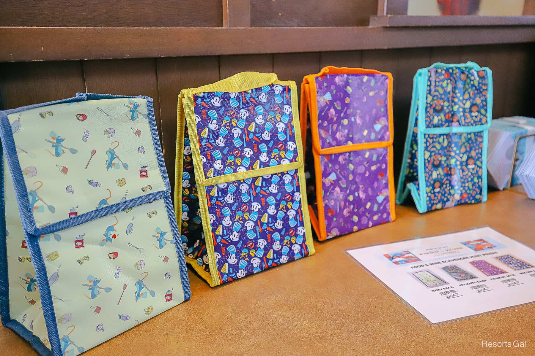 a row of lunchbox coolers with fun Food and Wine Festival theming 