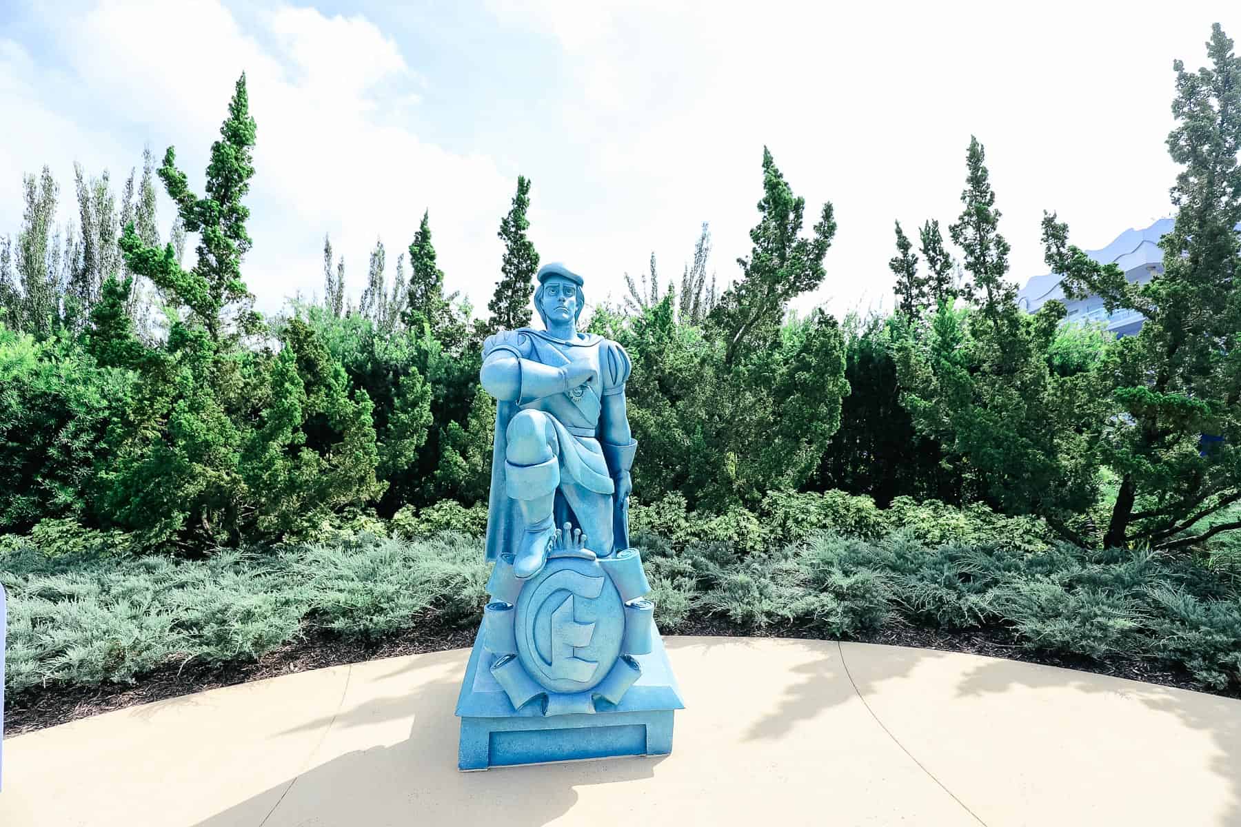 statue of Prince Eric at the entrance of the value Little Mermaid section 