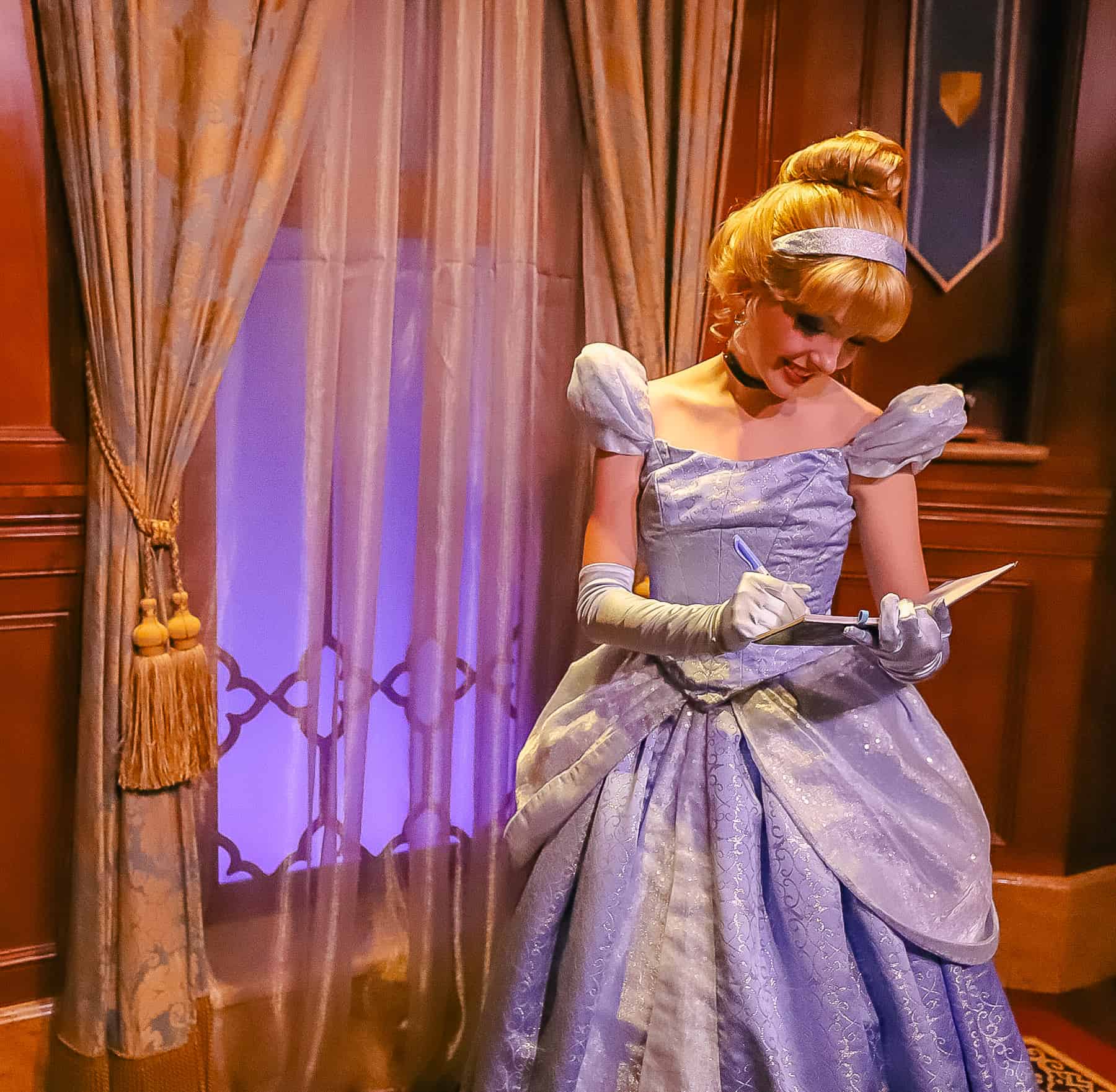 Cinderella signs her autograph. 