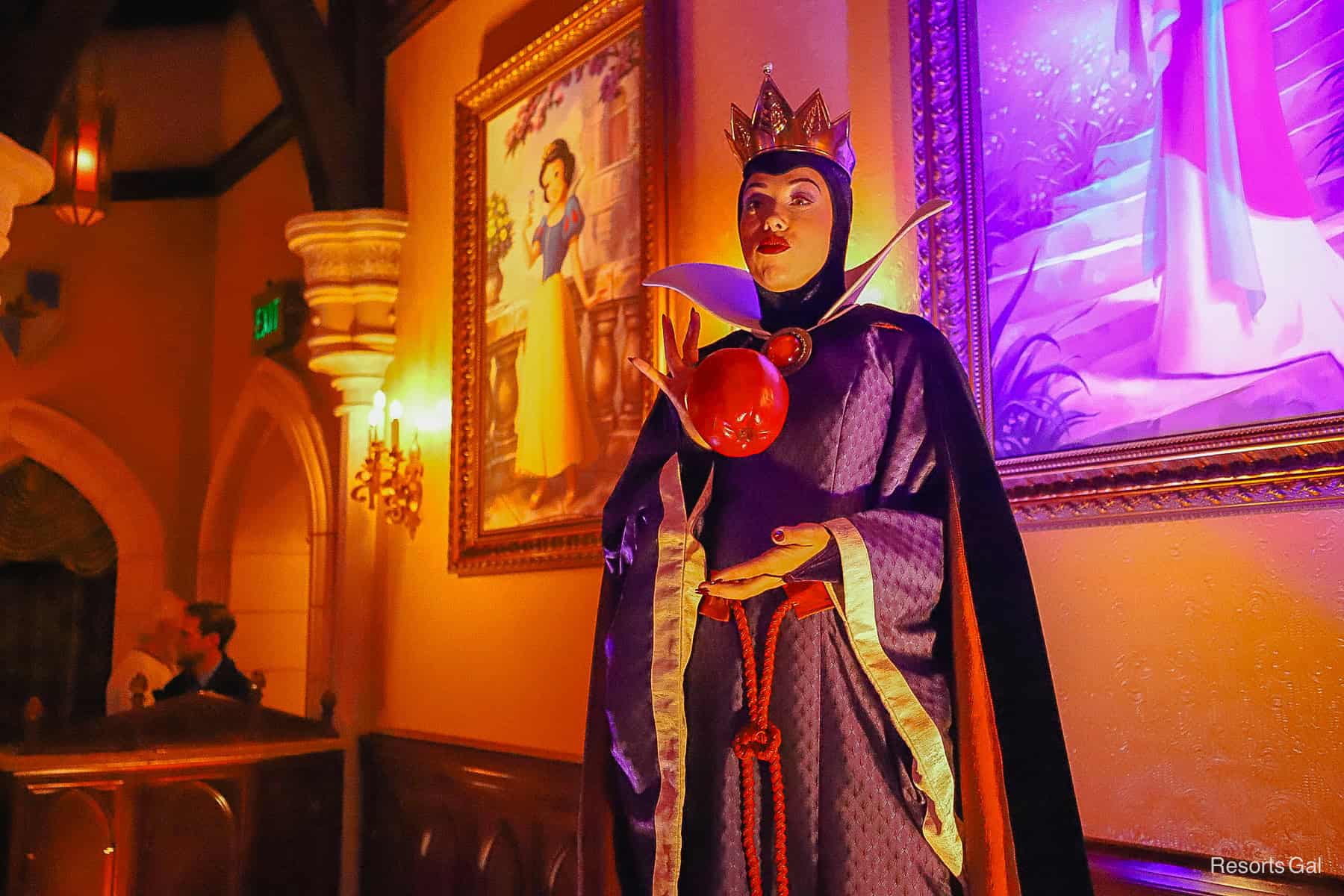 Evil Queen throws a red apple during Mickey's Halloween Party