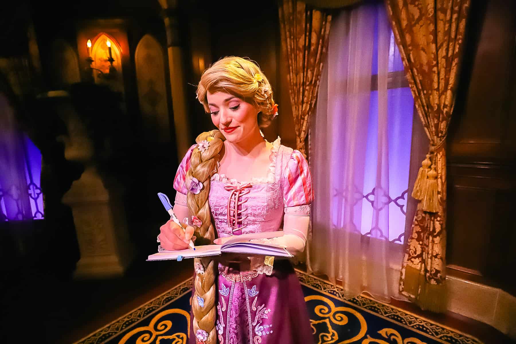 Rapunzel signing her autograph. 