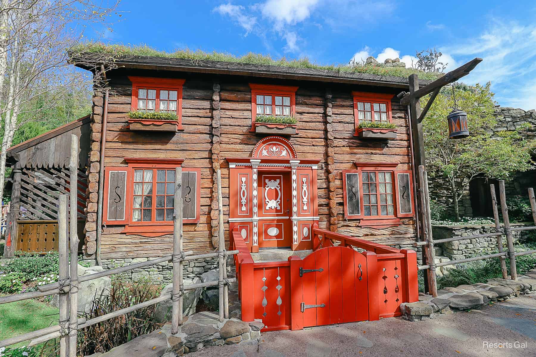 The Royal Sommerhus at Epcot is a brown building with red trim. 