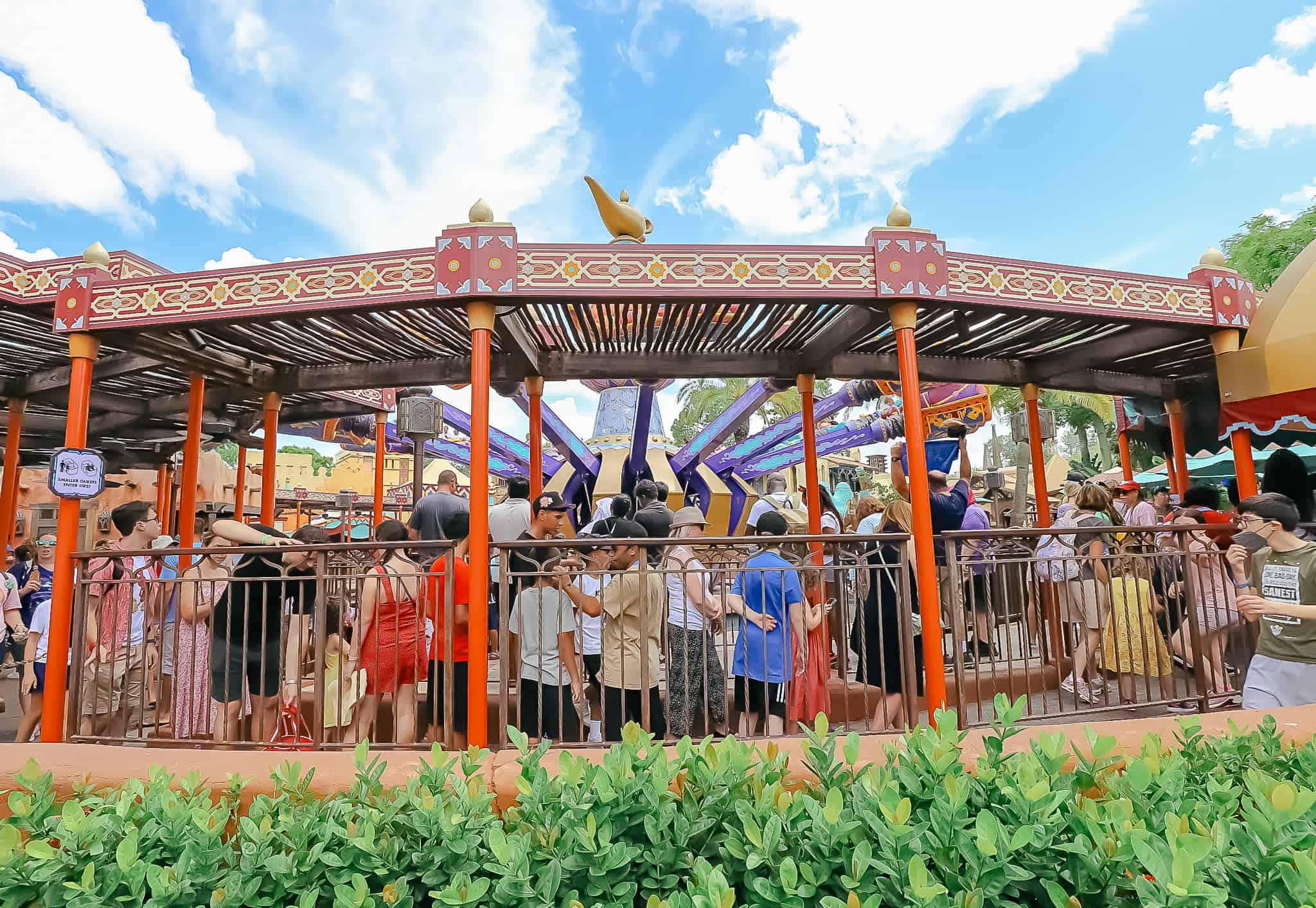 A longe queue of guests waiting to ride the Magic Carpets. 