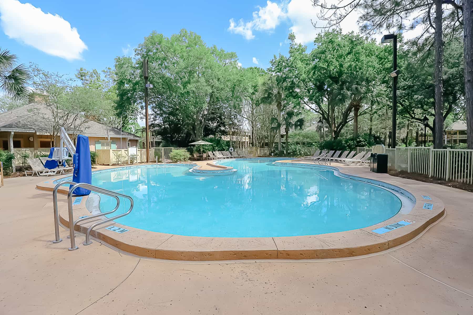 a pool in the shade at Riverside Resort 