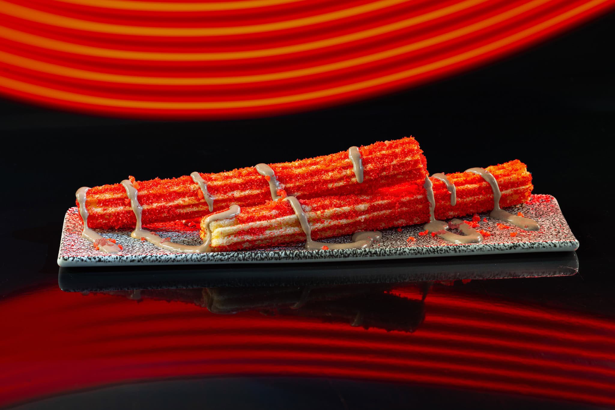 red churros with grey icing