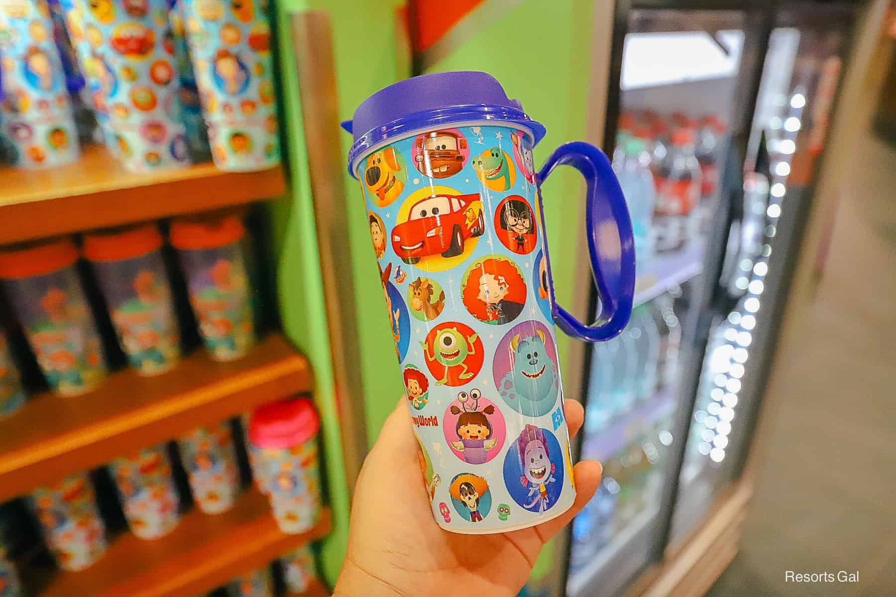 a new refillable Pixar mug design with a blue top and handle 