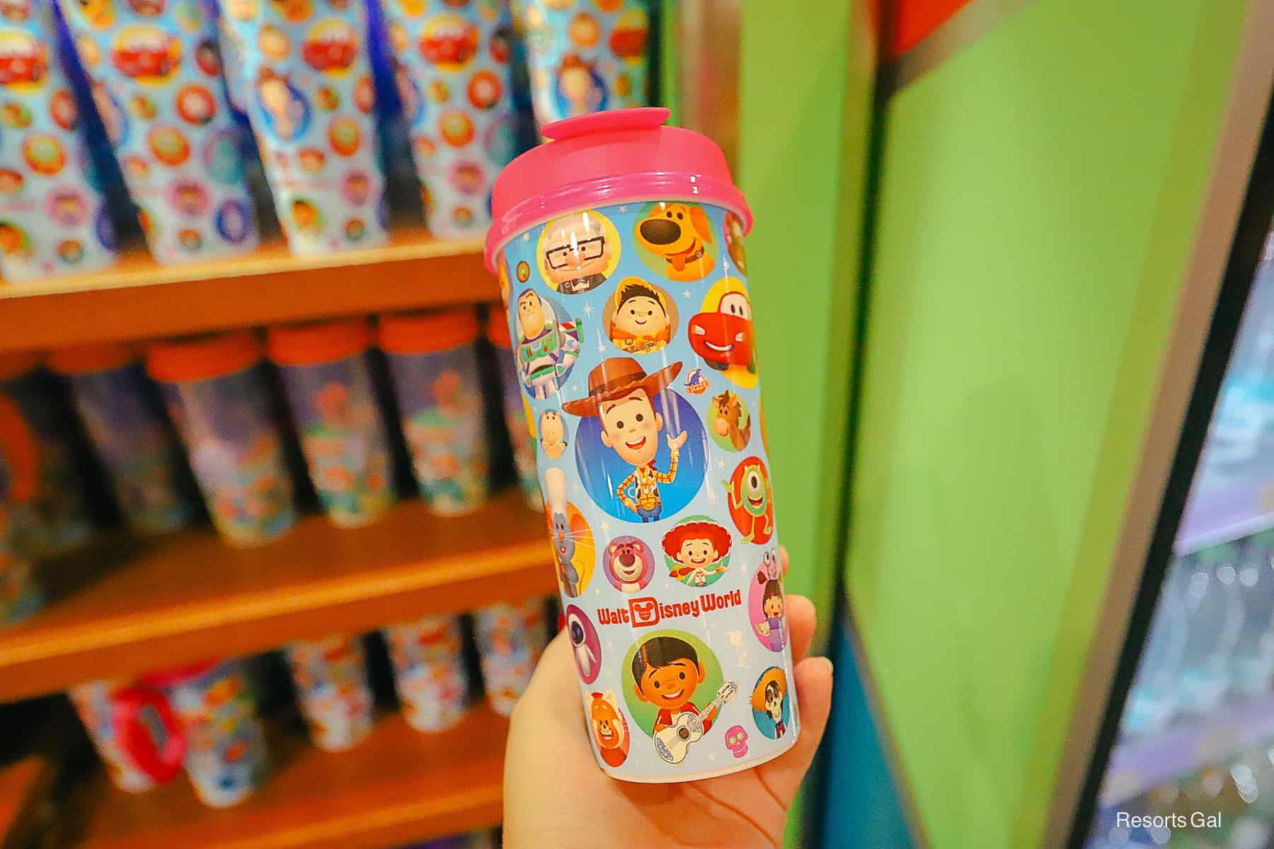 a new refillable mug with a pink top 