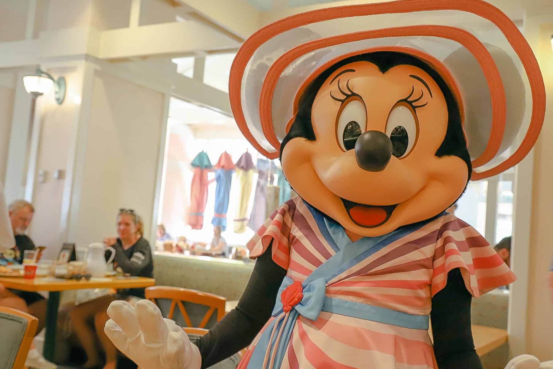 a photo of Minnie Mouse at a character dining location 