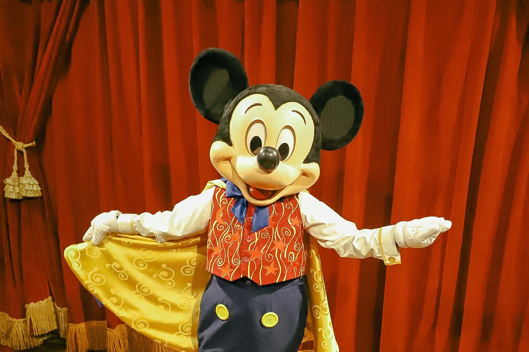 a picture of Mickey Mouse posing for the camera. 