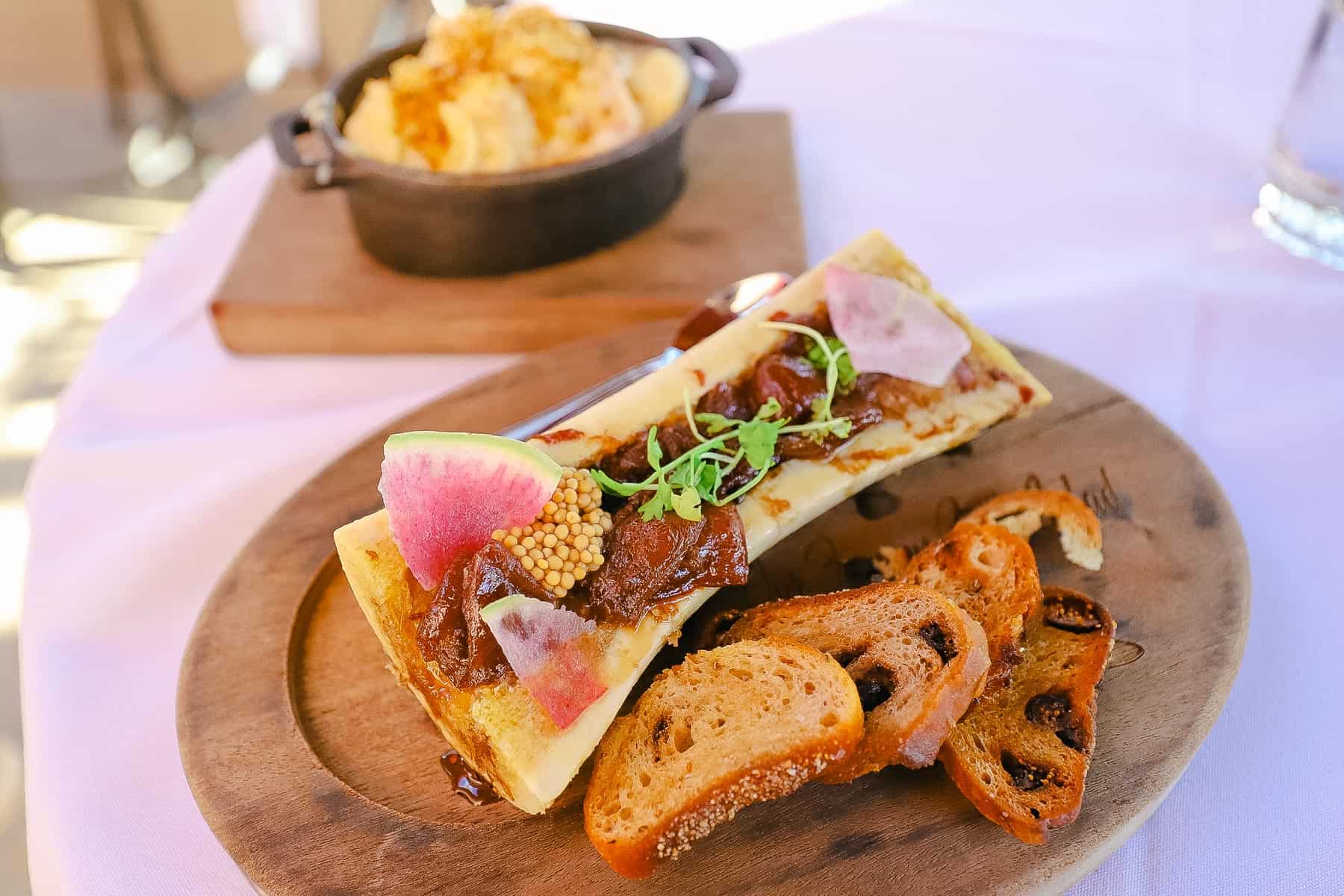 A photo of a meal at a Disney restaurant that includes bone marrow. 