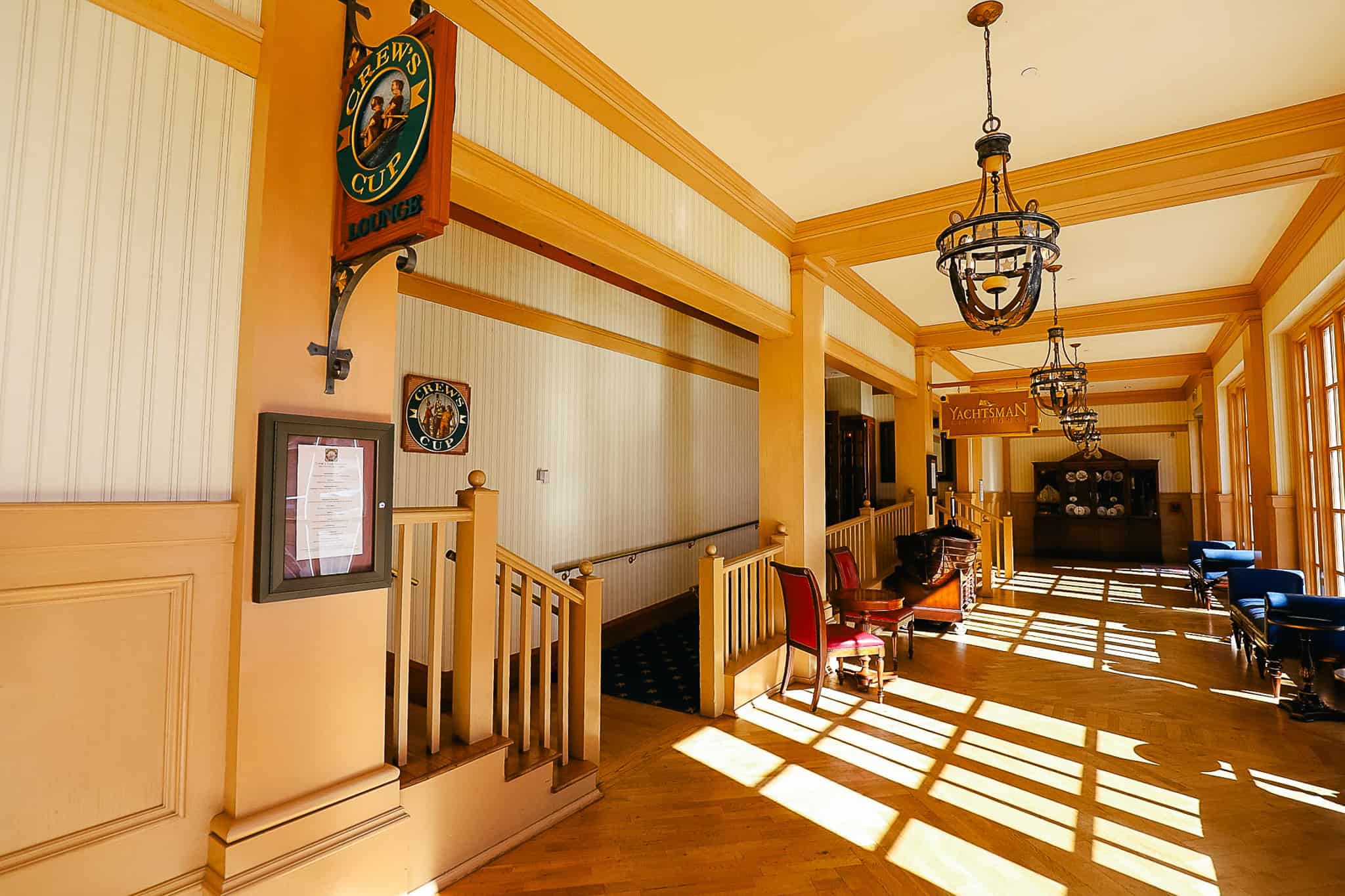 the hallway with wooden floors and accents in front of the entrance of Yachtsman Steakhouse 