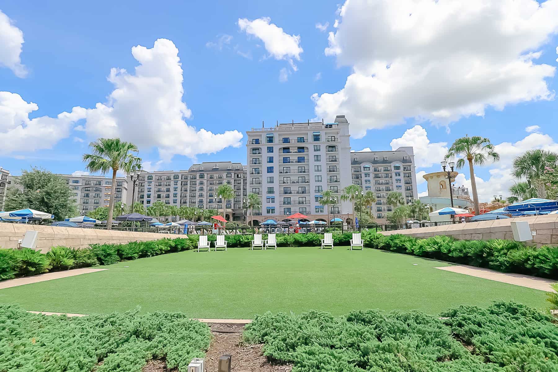 the green back lawn behind the pool at Disney's Riviera Resort 