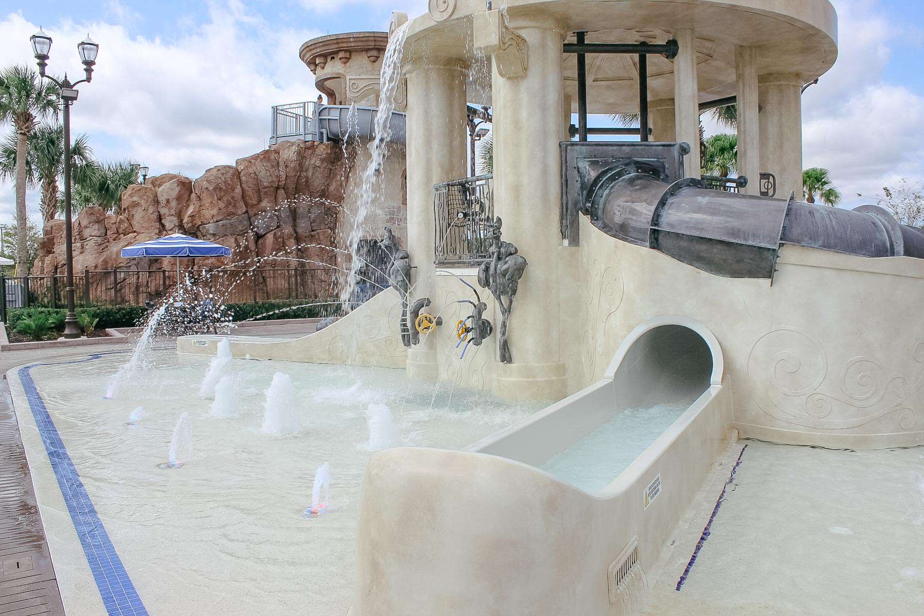 a miniature waterslide in the aquatic play area 