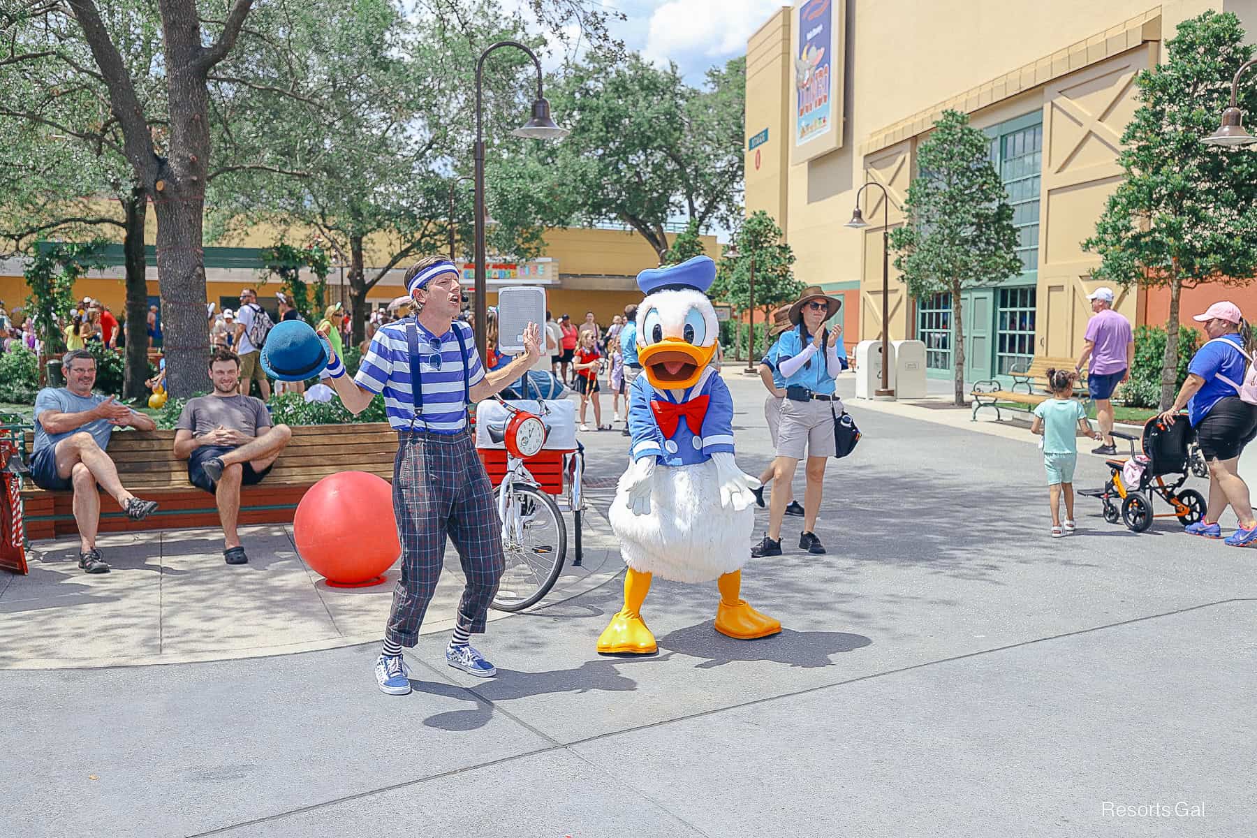 Donald interacting with guests and a performer