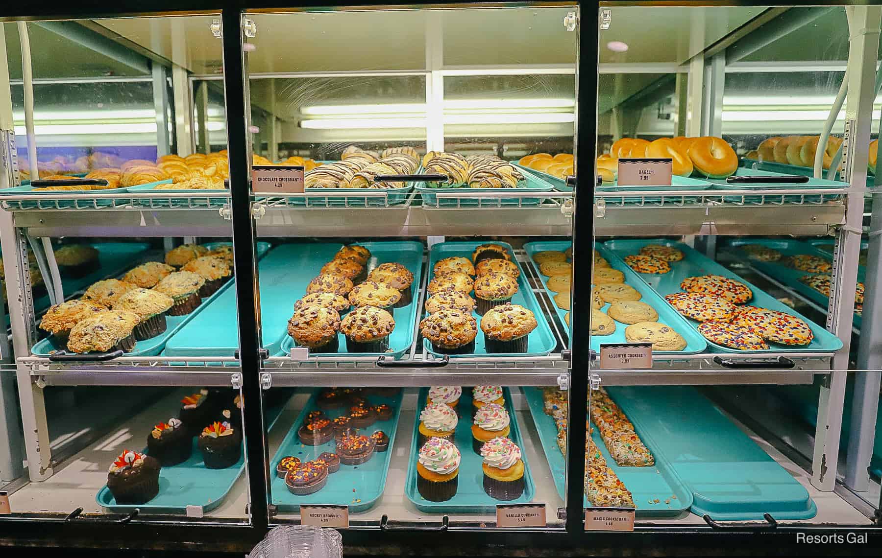 a case with muffins, cupcakes, donuts, and other pastries at Roaring Fork 