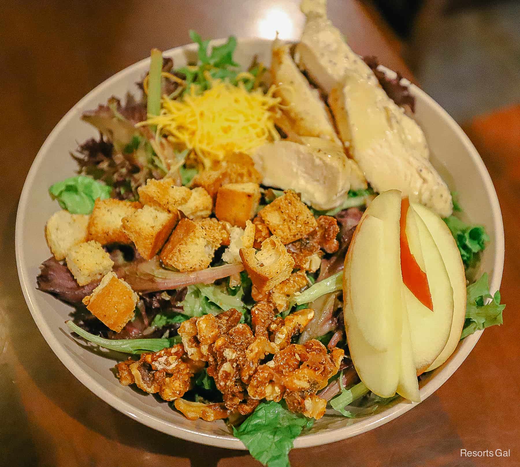 an alternate view of the large salad with chicken, croutons, and cheese