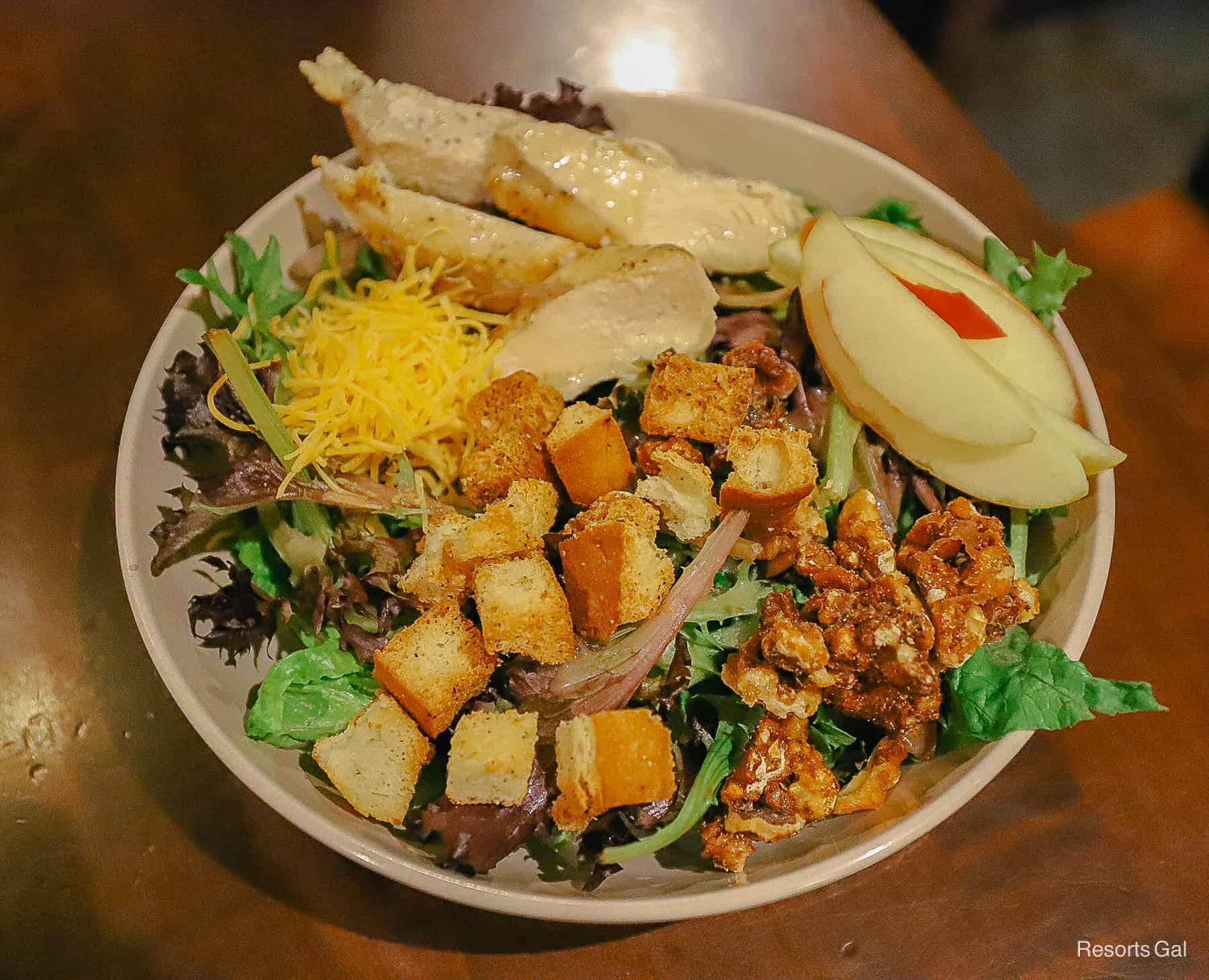 the Wilderness Lodge salad topped with candied pecans and apple slices 