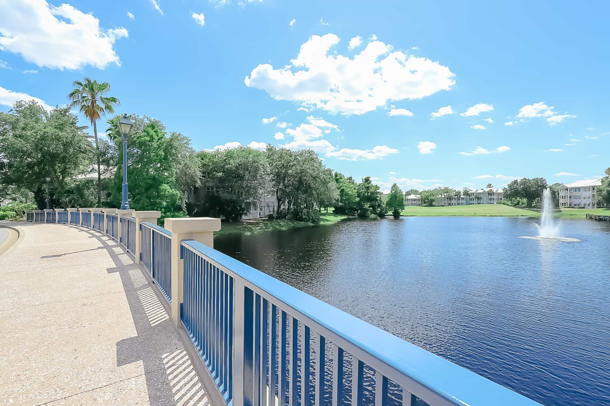 scenic view of a lake with a fountain 