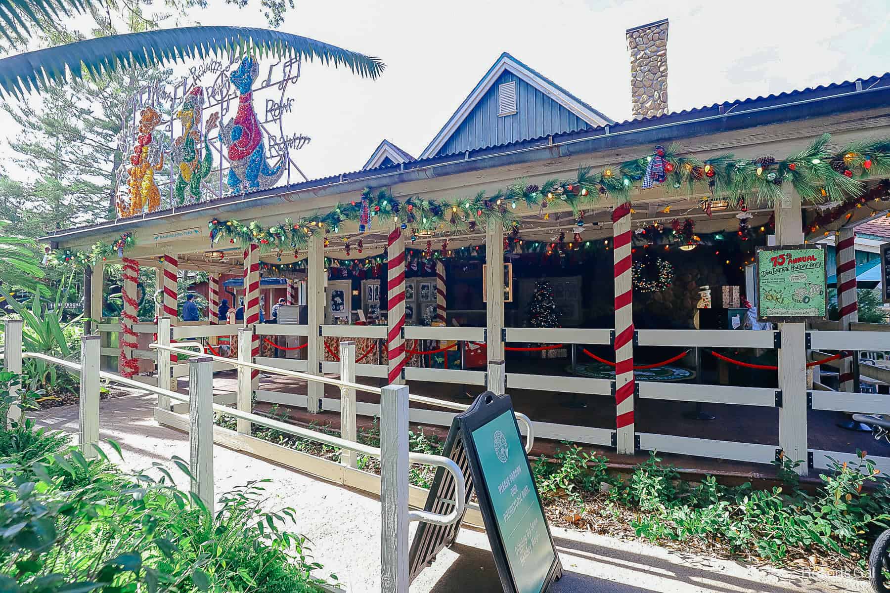 the entrance to the Dinoland USA Santa Claus meet and greet in 2025