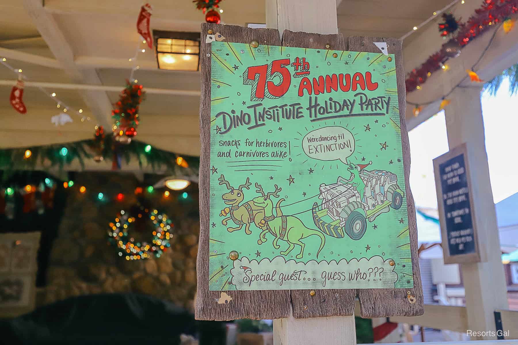 a sign that celebrates the 75th annual Dino Institute Holiday Party 