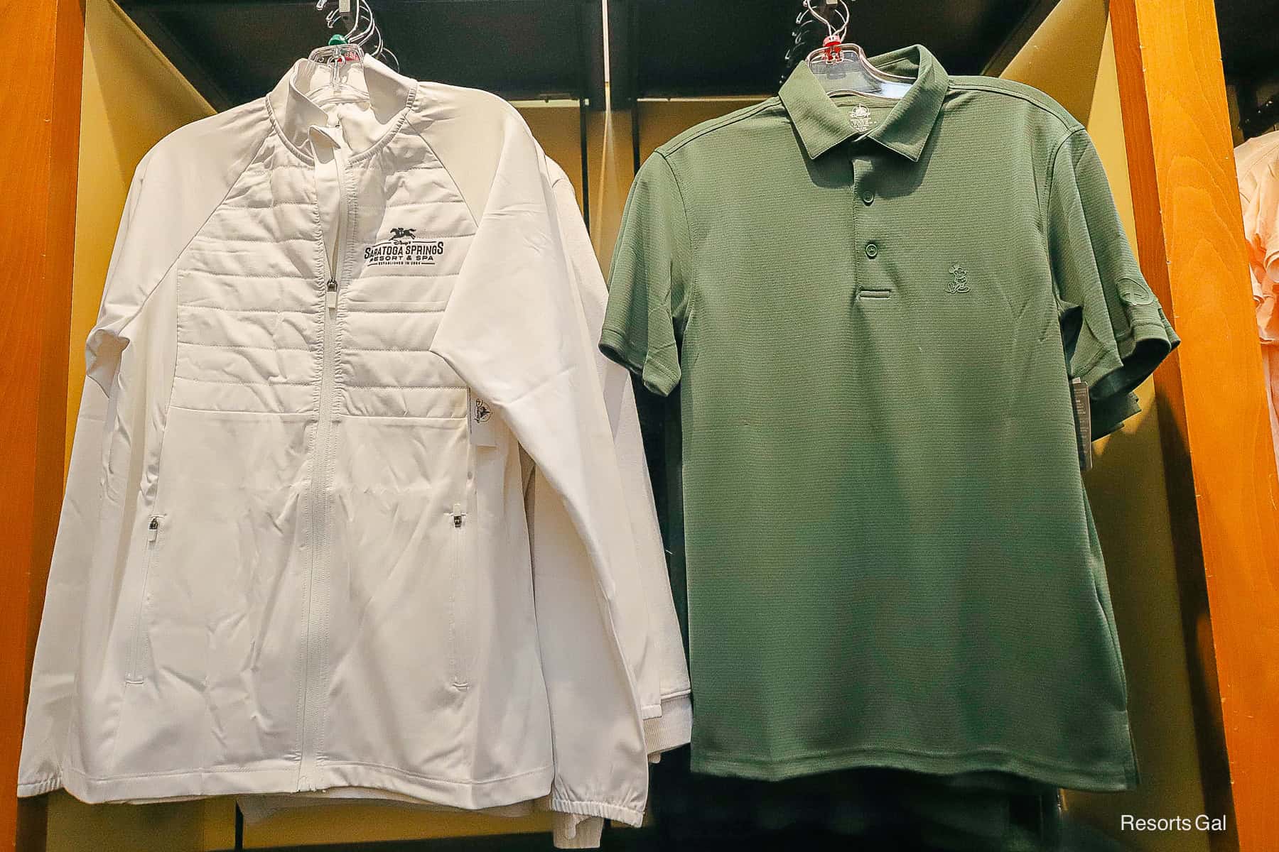 a hunter grreen polo style of shirt with Mickey Mouse logo 