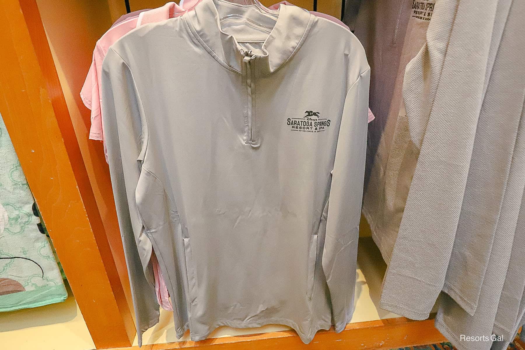 a silver long sleeve pullover with partial zipper 