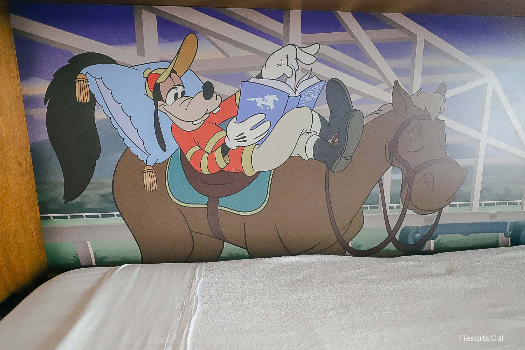 a closeup of Goofy artwork where he's sleeping on a horse