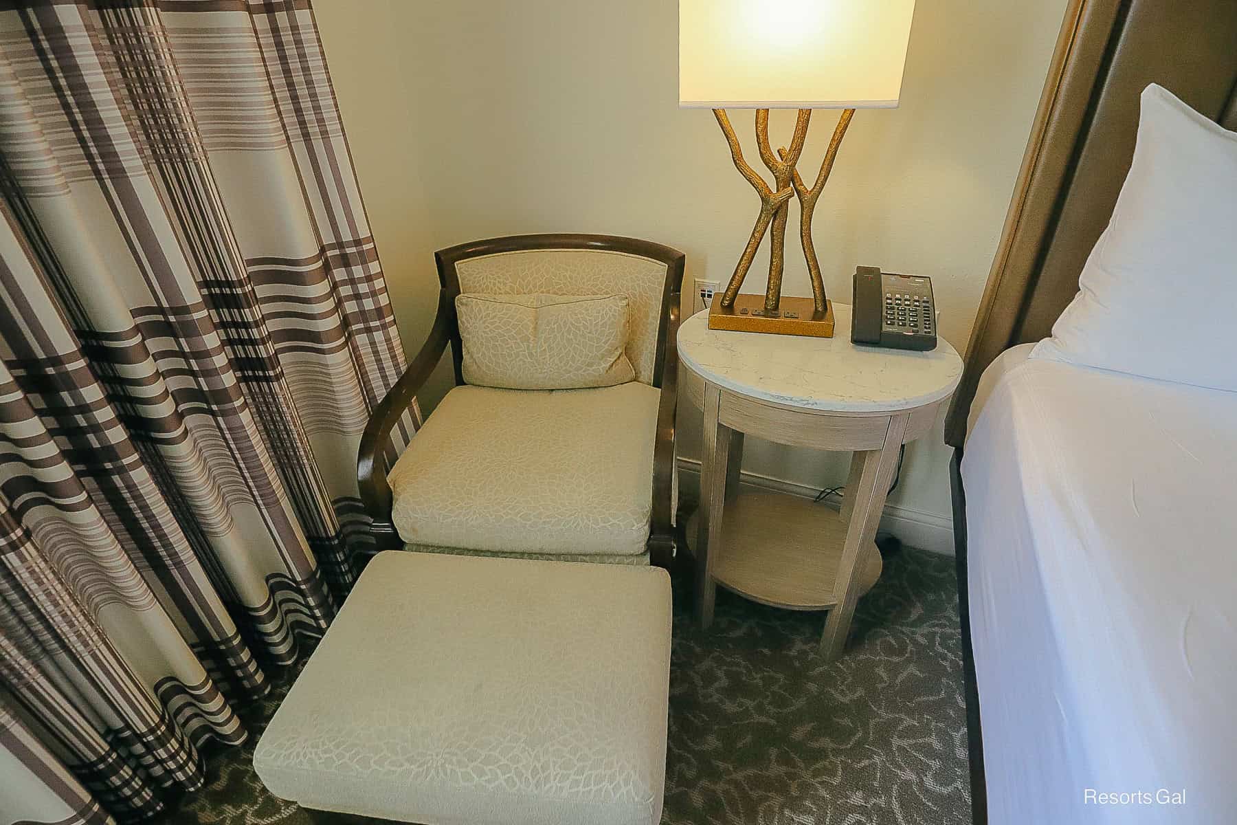 a bedside chair with lamp