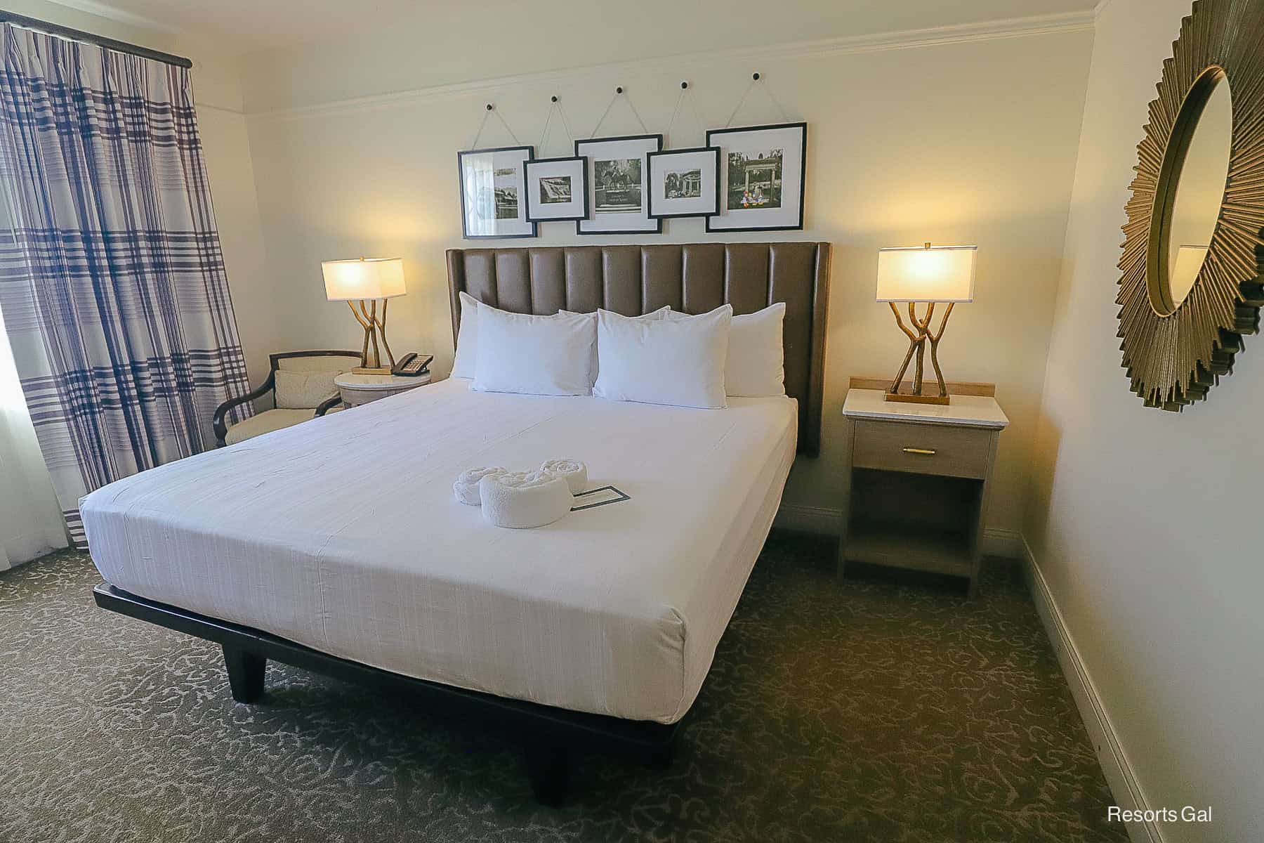the primary bedroom with a king size bed in the 2-bedroom villa at Disney's Saratoga Springs Resort