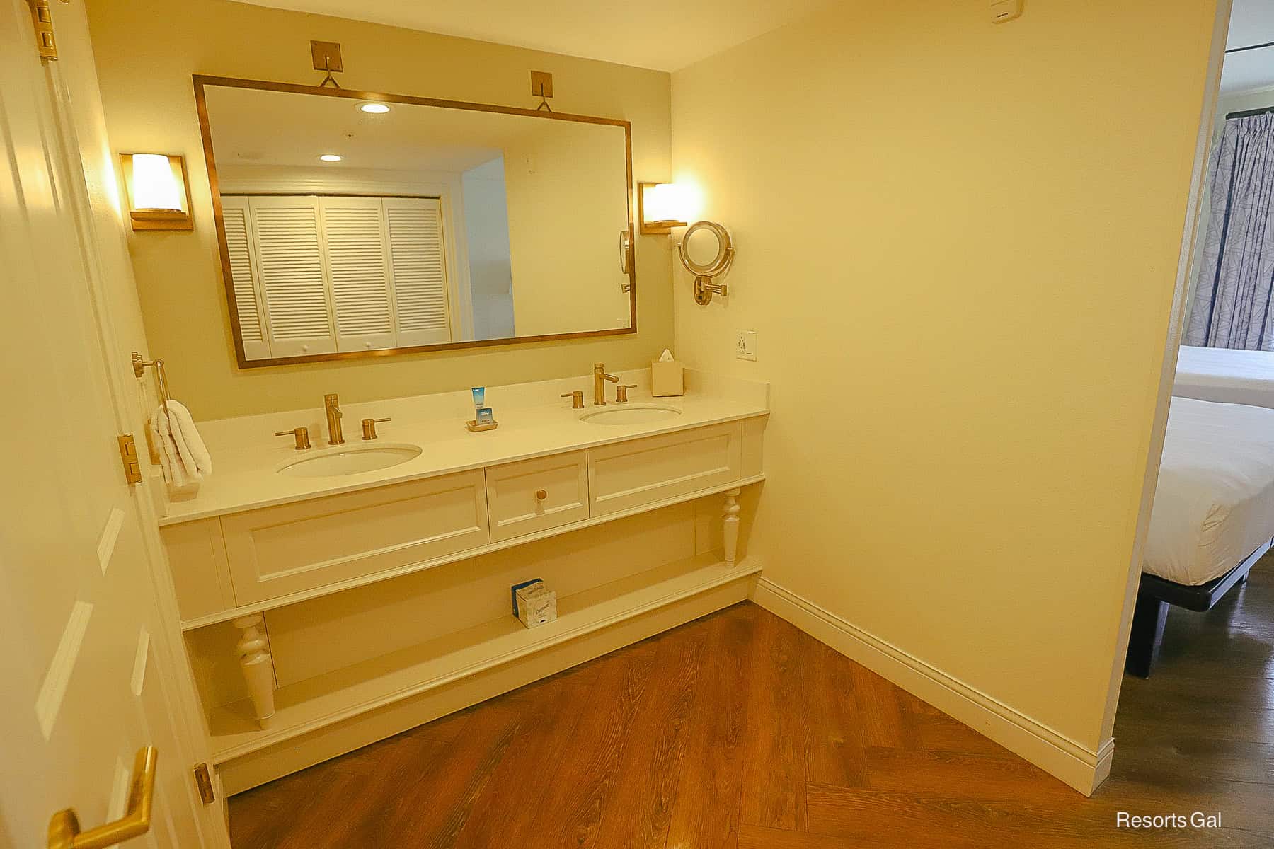 a vanity in the bath area with two sinks