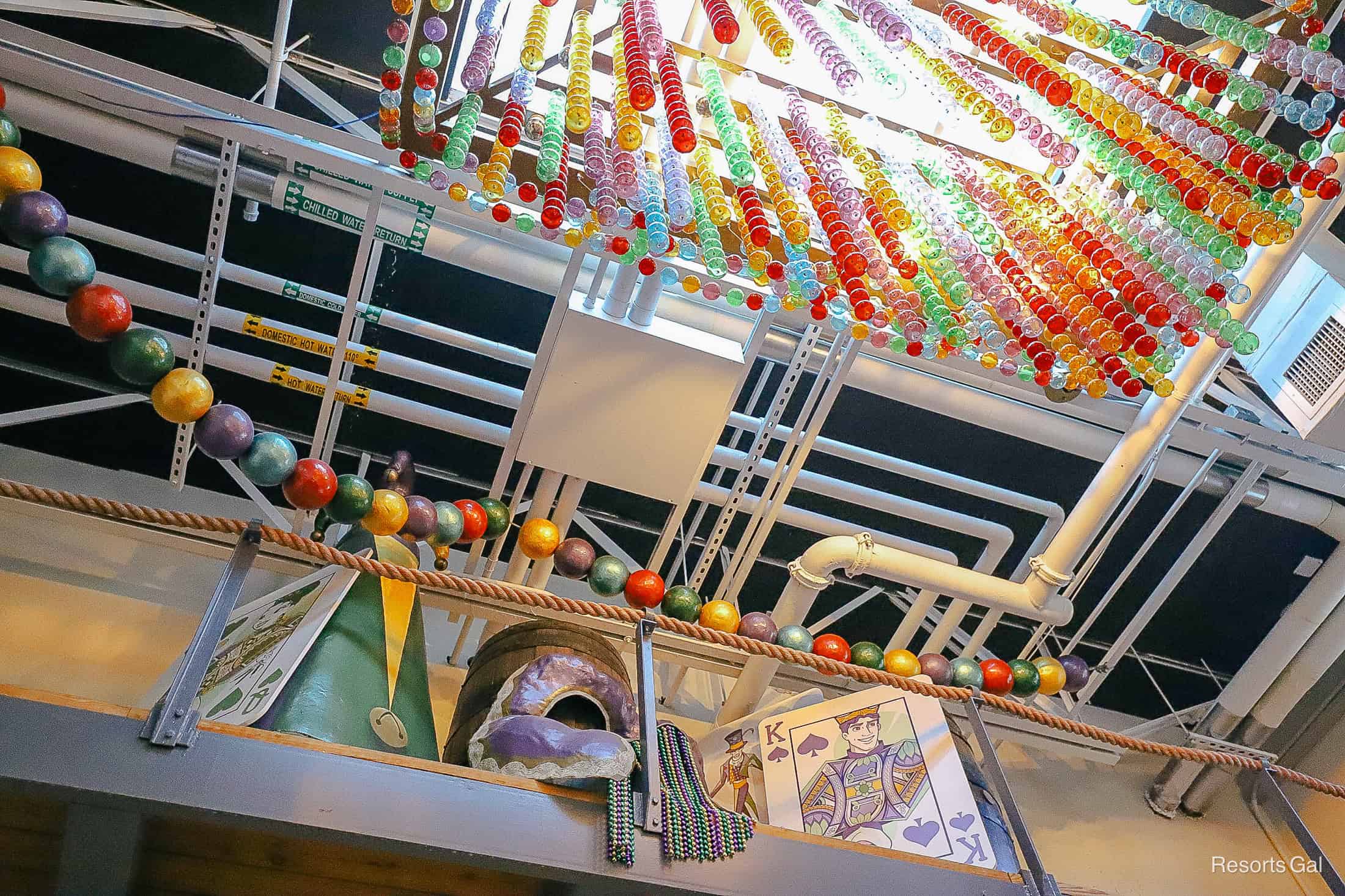 bright glass ceiling light fixtures in reds, greens, oranges, and blues hanging in Sassagoula Floatworks and Food Factory 