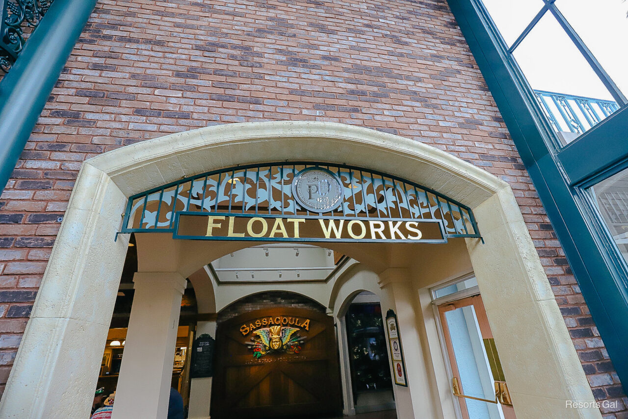 an iron sign that says Float Works near the lobby entrance of the resort's quick service restaurant 
