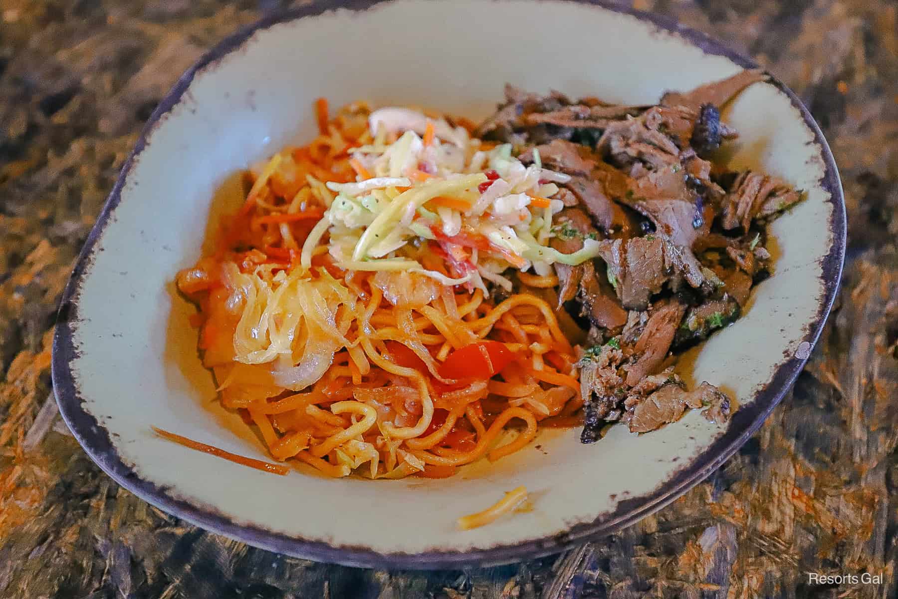 a bowl with beef and noodles from Satu'li Canteen 