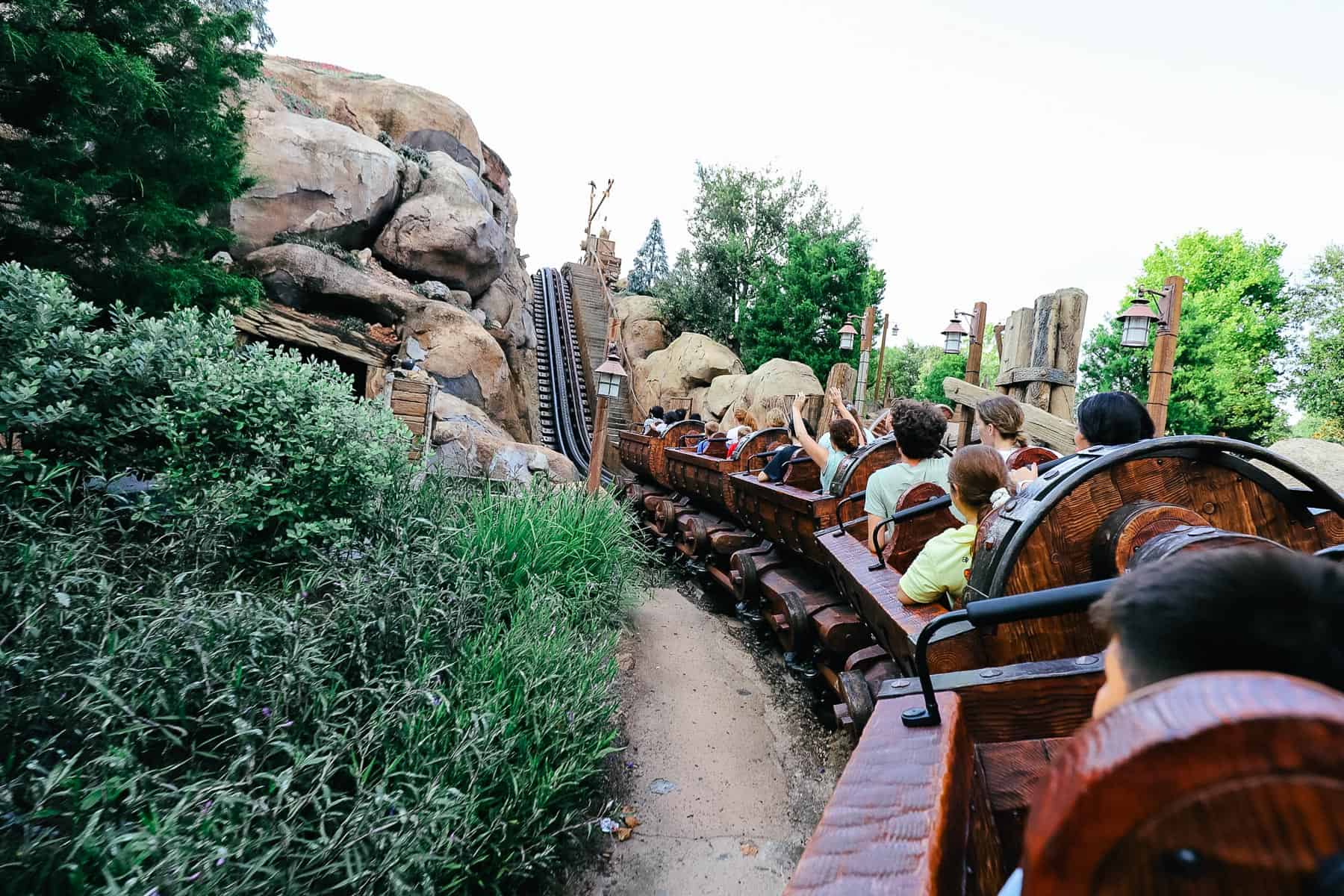 Guests riding the Seven Dwarfs Mine Train up the first lift. 