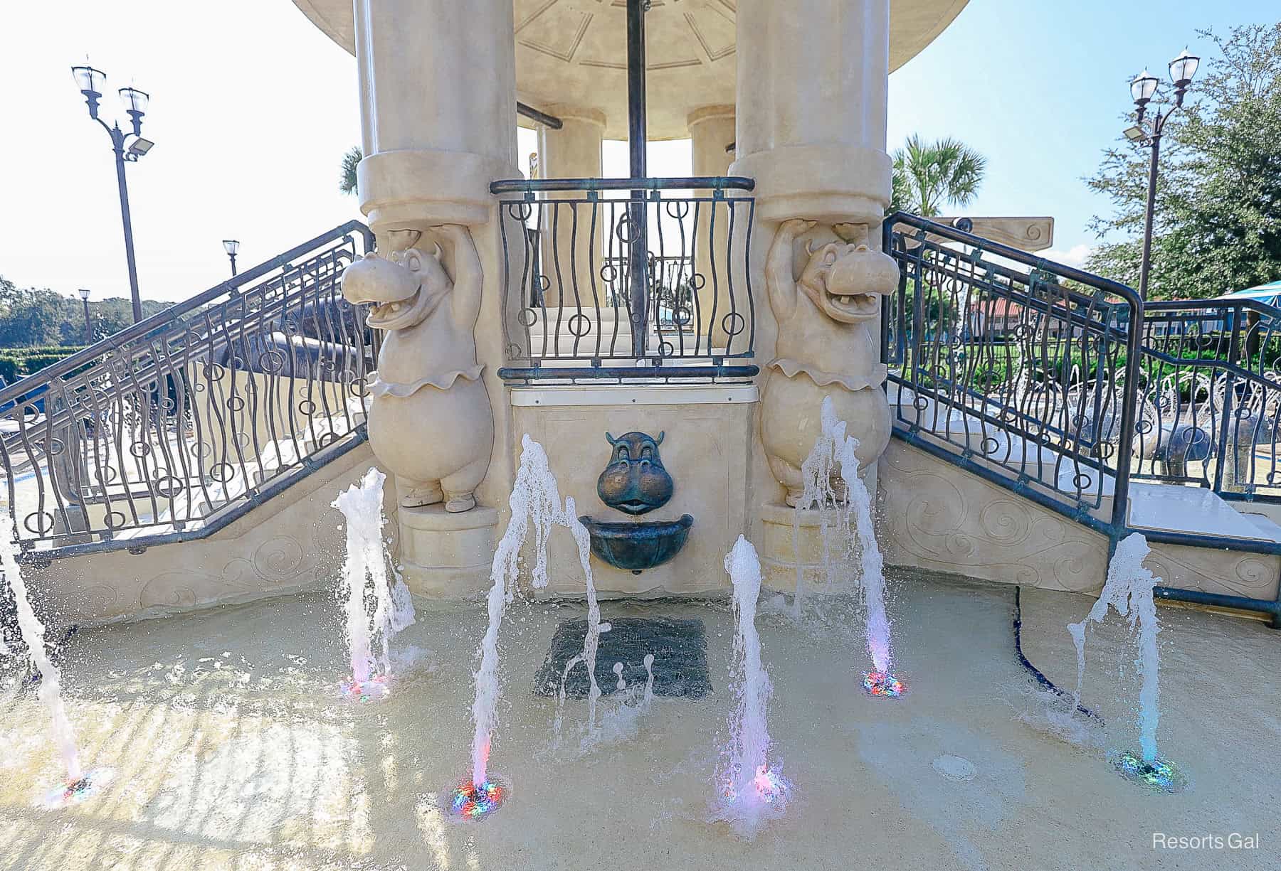 Hippopotamus from Fantasia holding up the columns of the water play area 