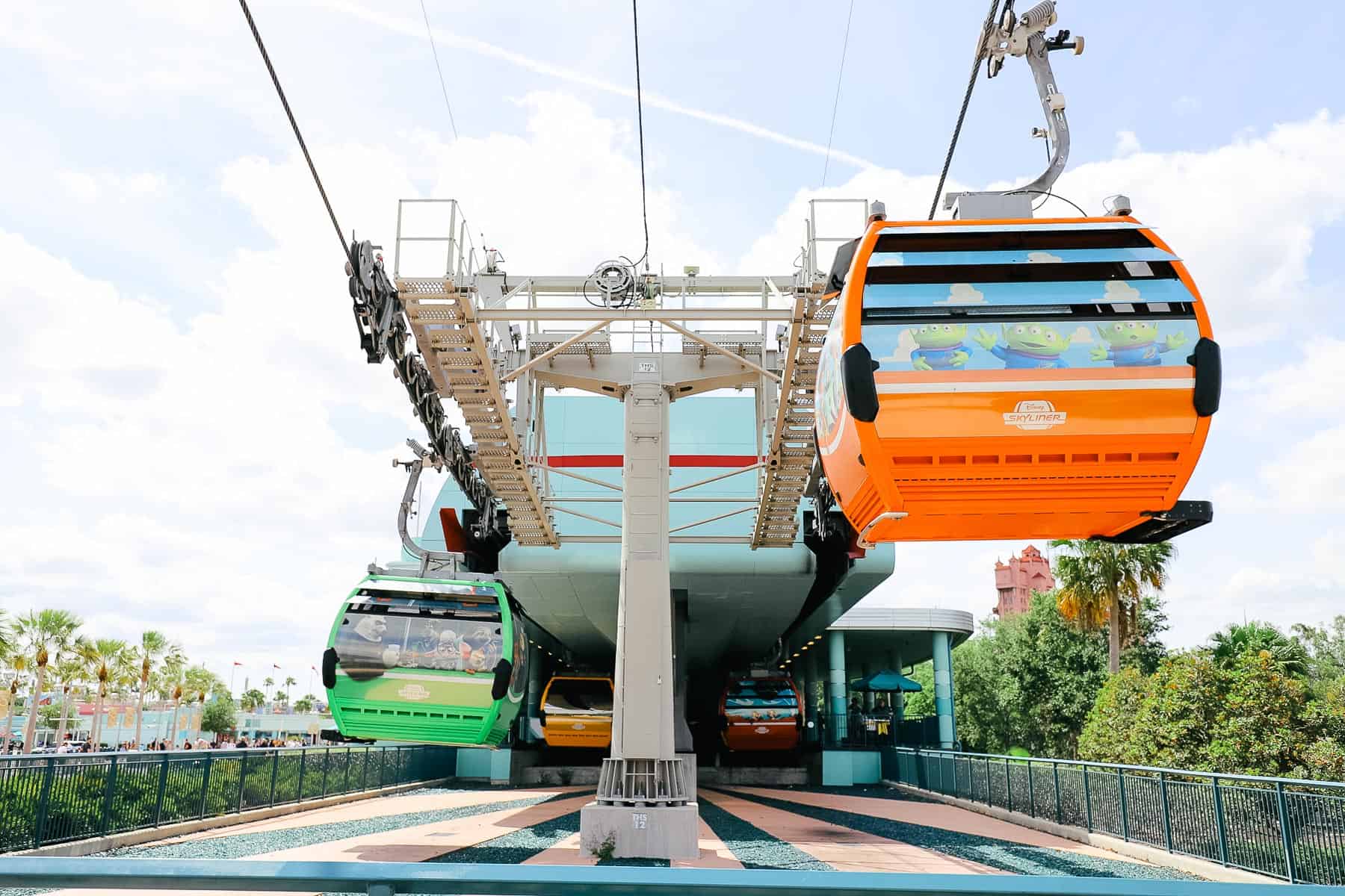 an orange and green Skyliner gondola