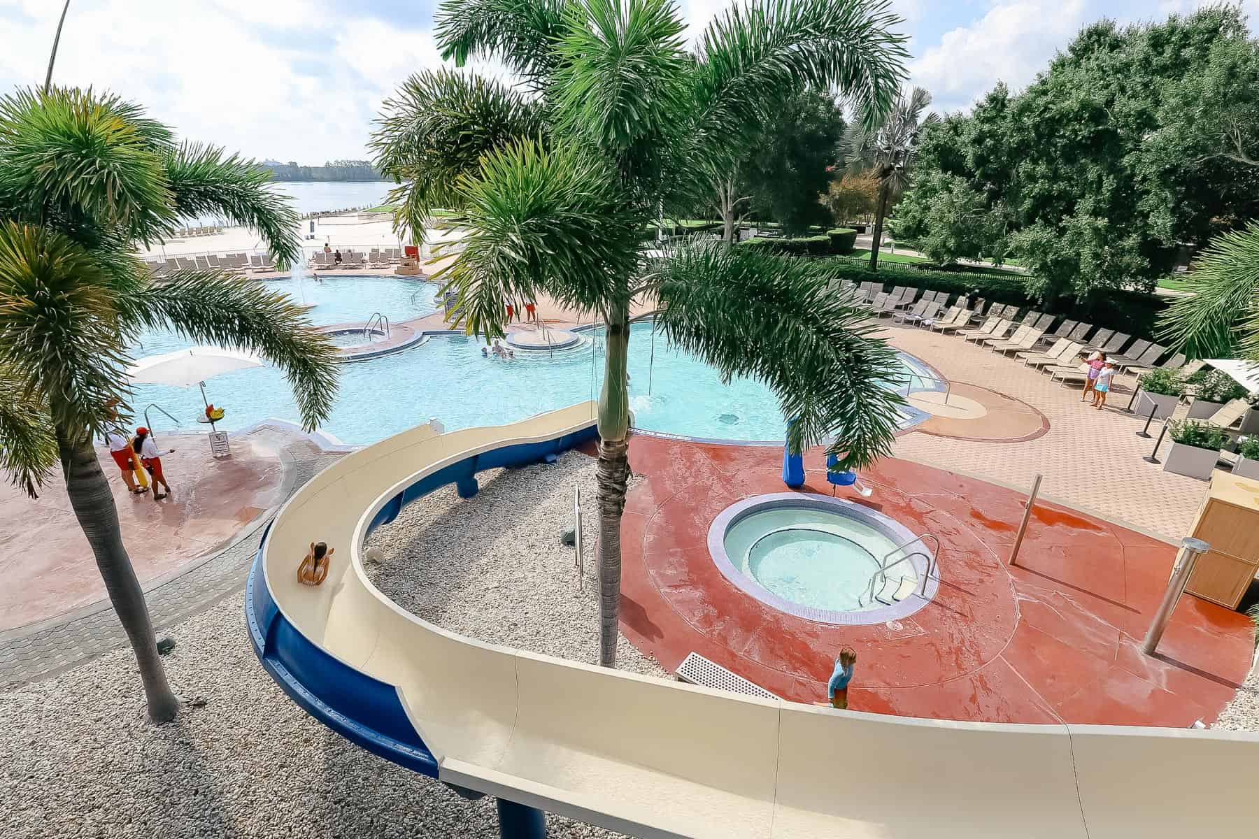 The water slide exits into the pool.