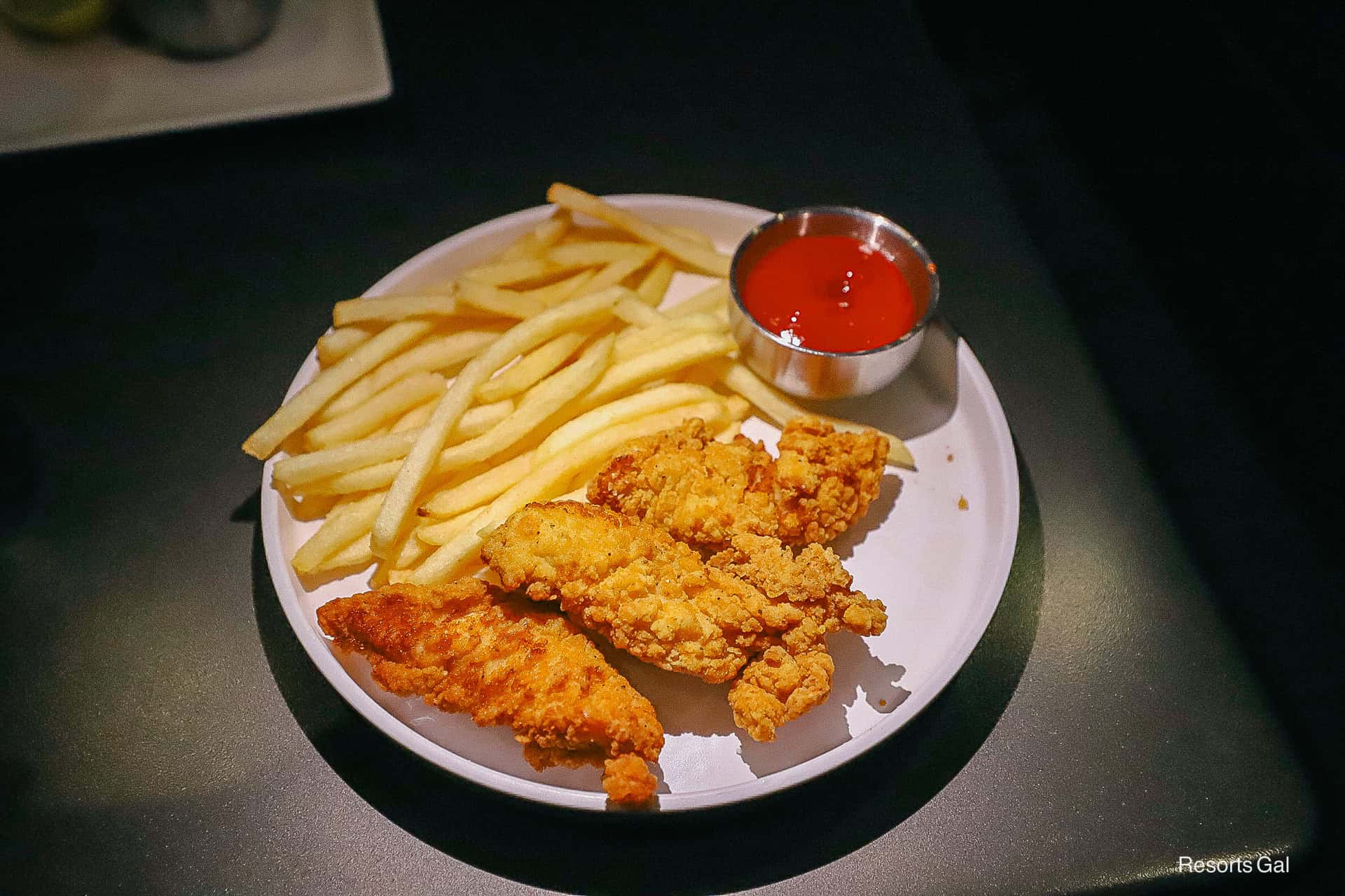 an order of Cosmic Chicken from Space 220 (fried chicken tenders, fries, and ketchup)