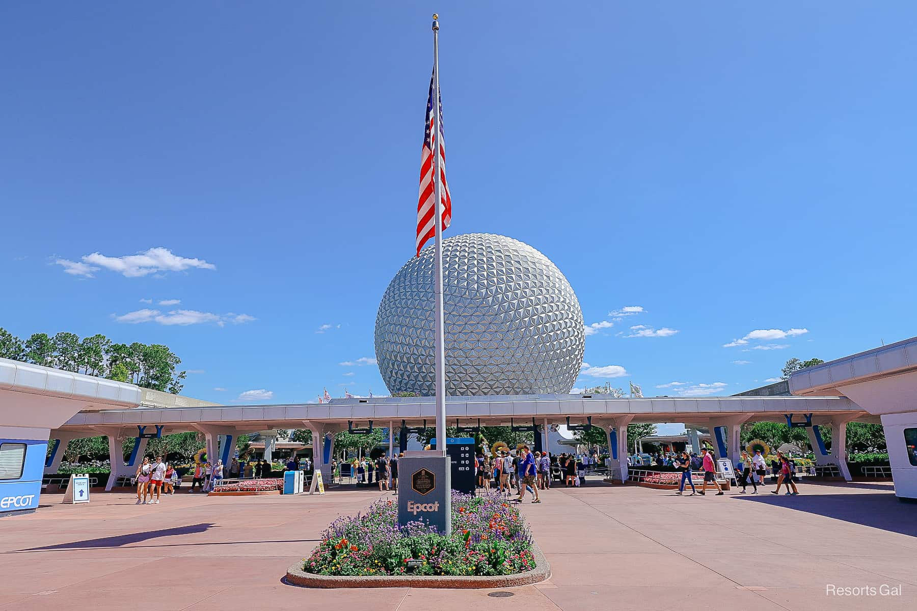 Spaceship Earth sitting beyond the ticket turnstiles at Epcot. 