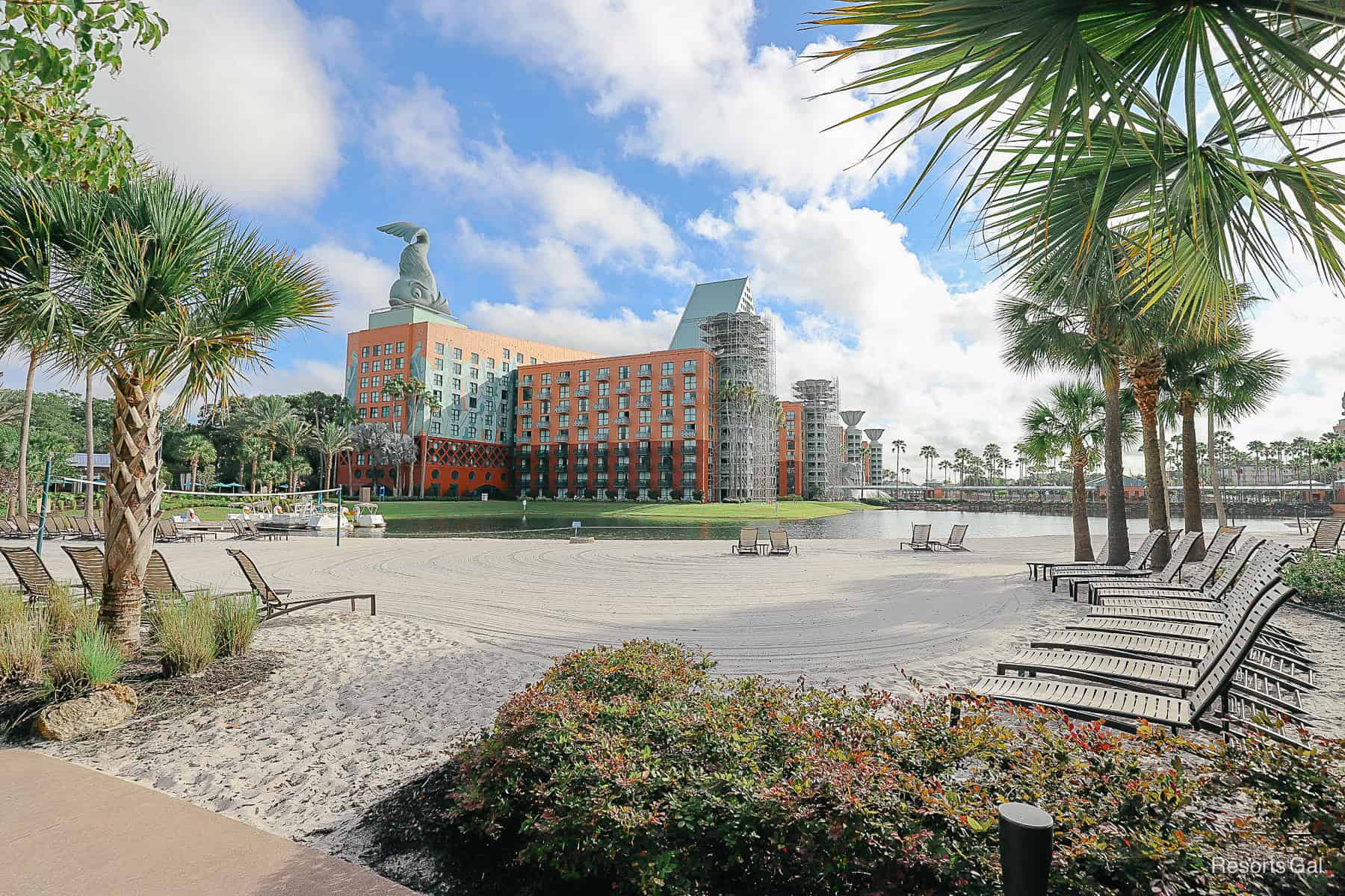 a relaxing beach by a lake at a Disney Resort Hotel