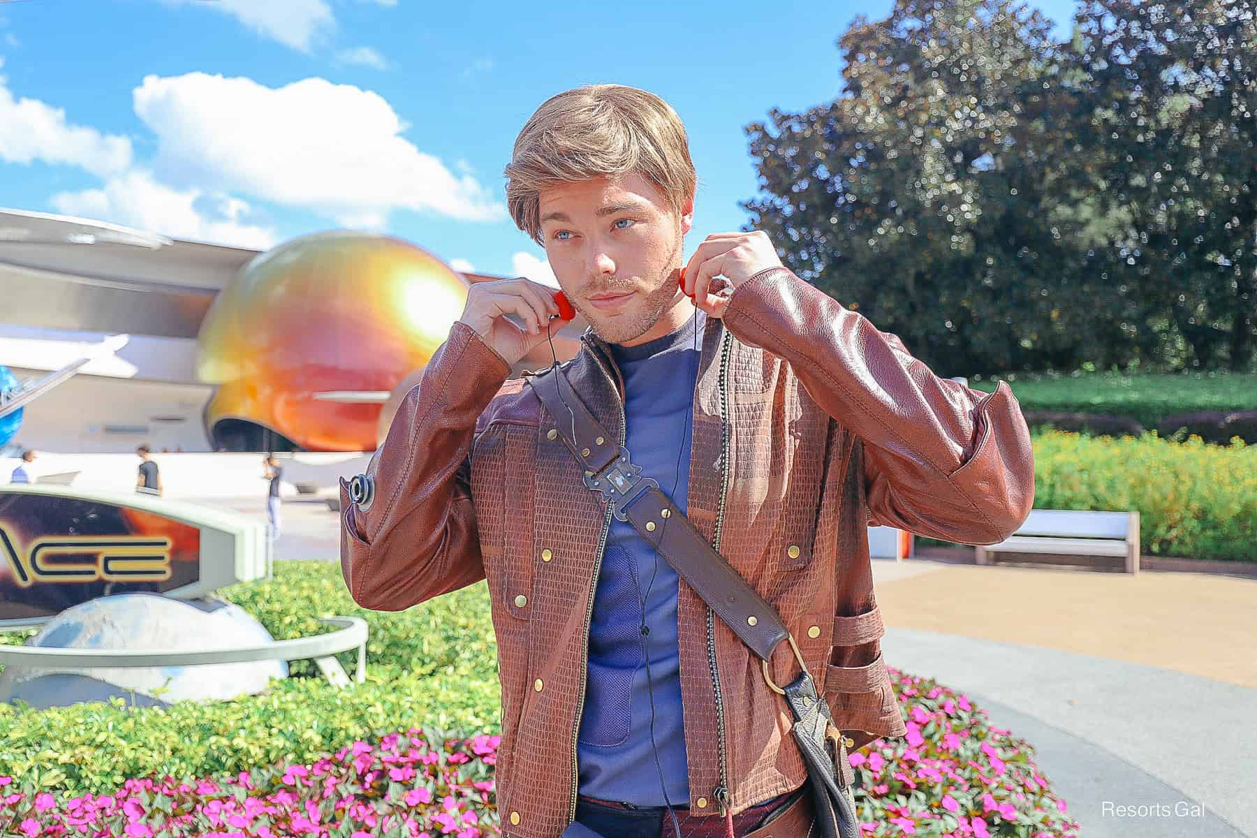 Star-Lord adjusts his headphones 