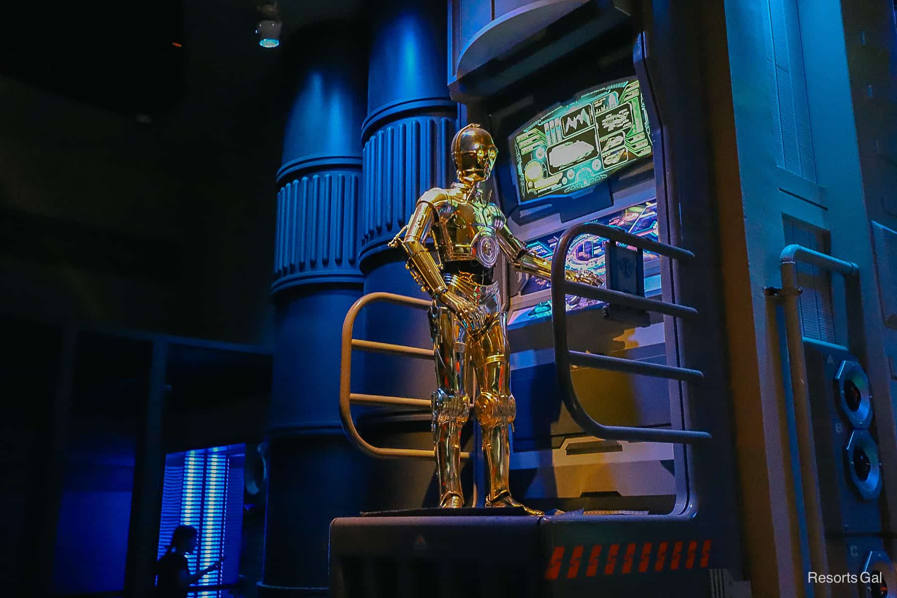 C3P0 is busy at a computer in the queue of Star Tours at Hollywood Studios. 