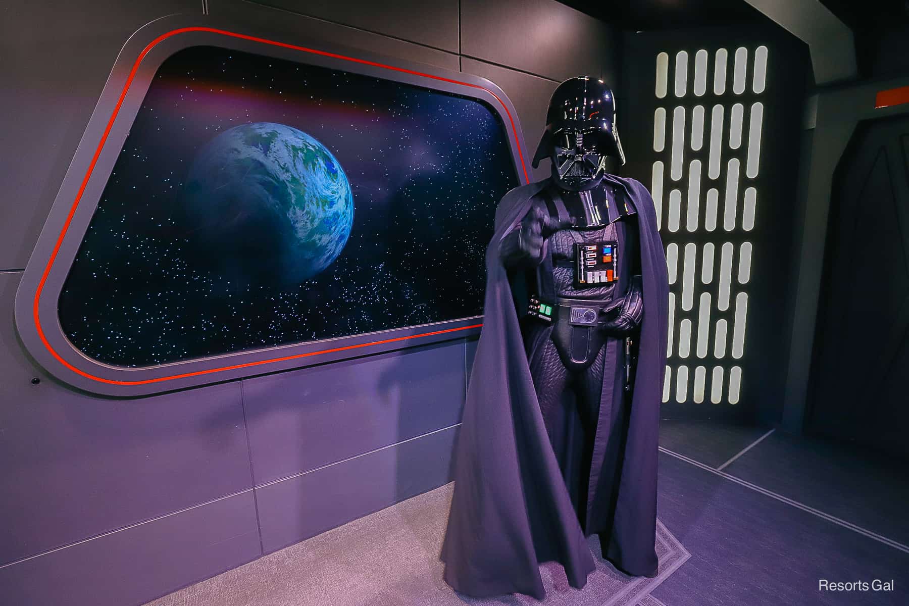 Darth Vader points as he's telling the next guest to enter his character meet. 